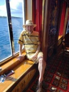 A man sitting on a window sill