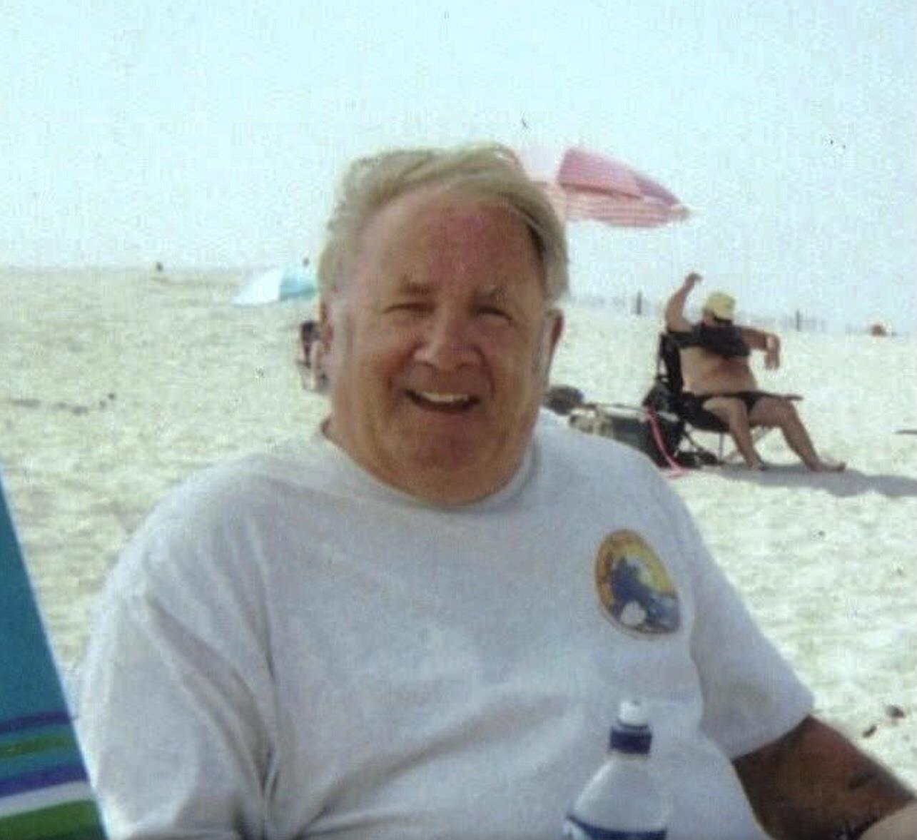 A man sitting on a beach