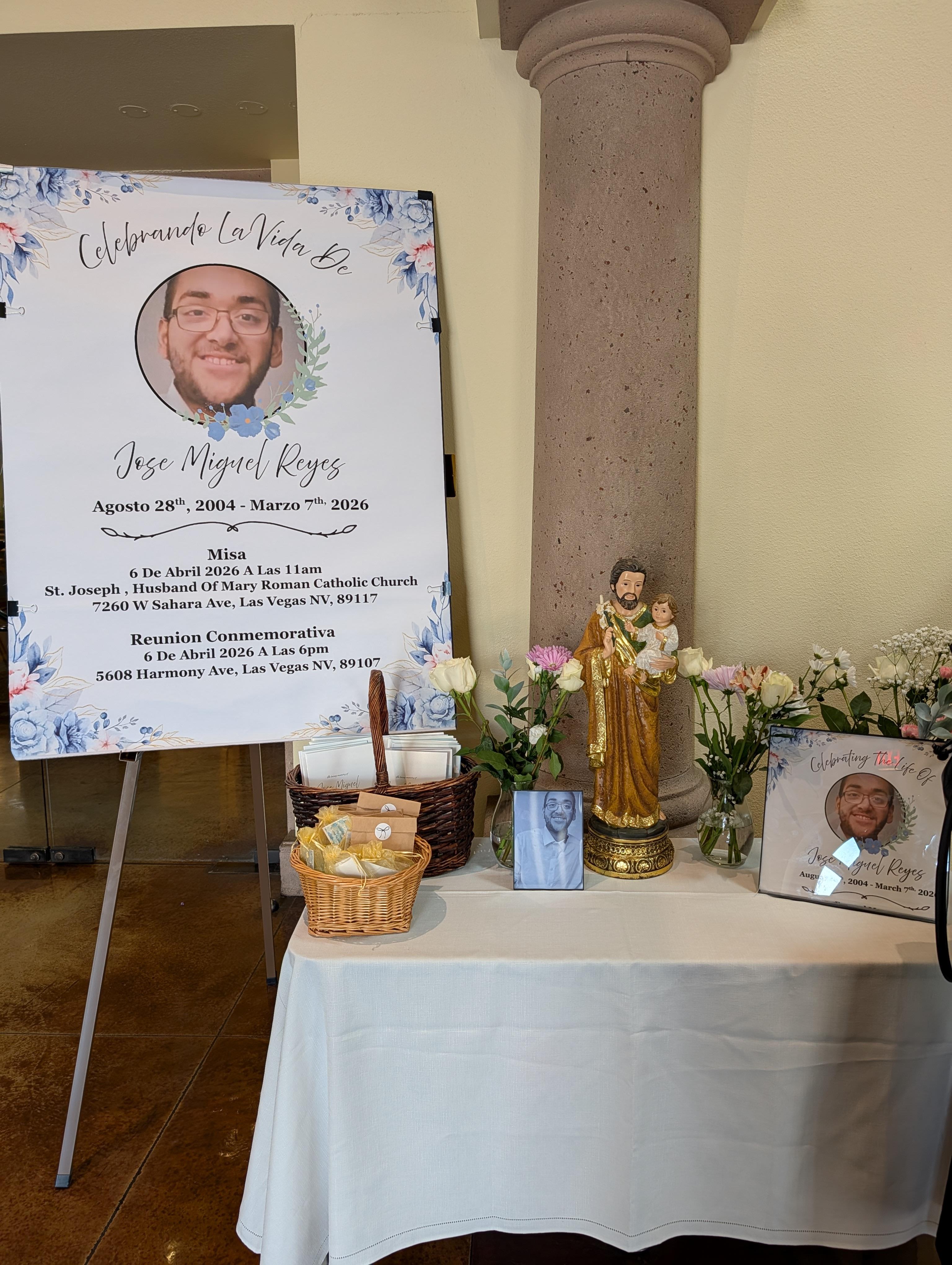 A memorial sign with a picture of a man