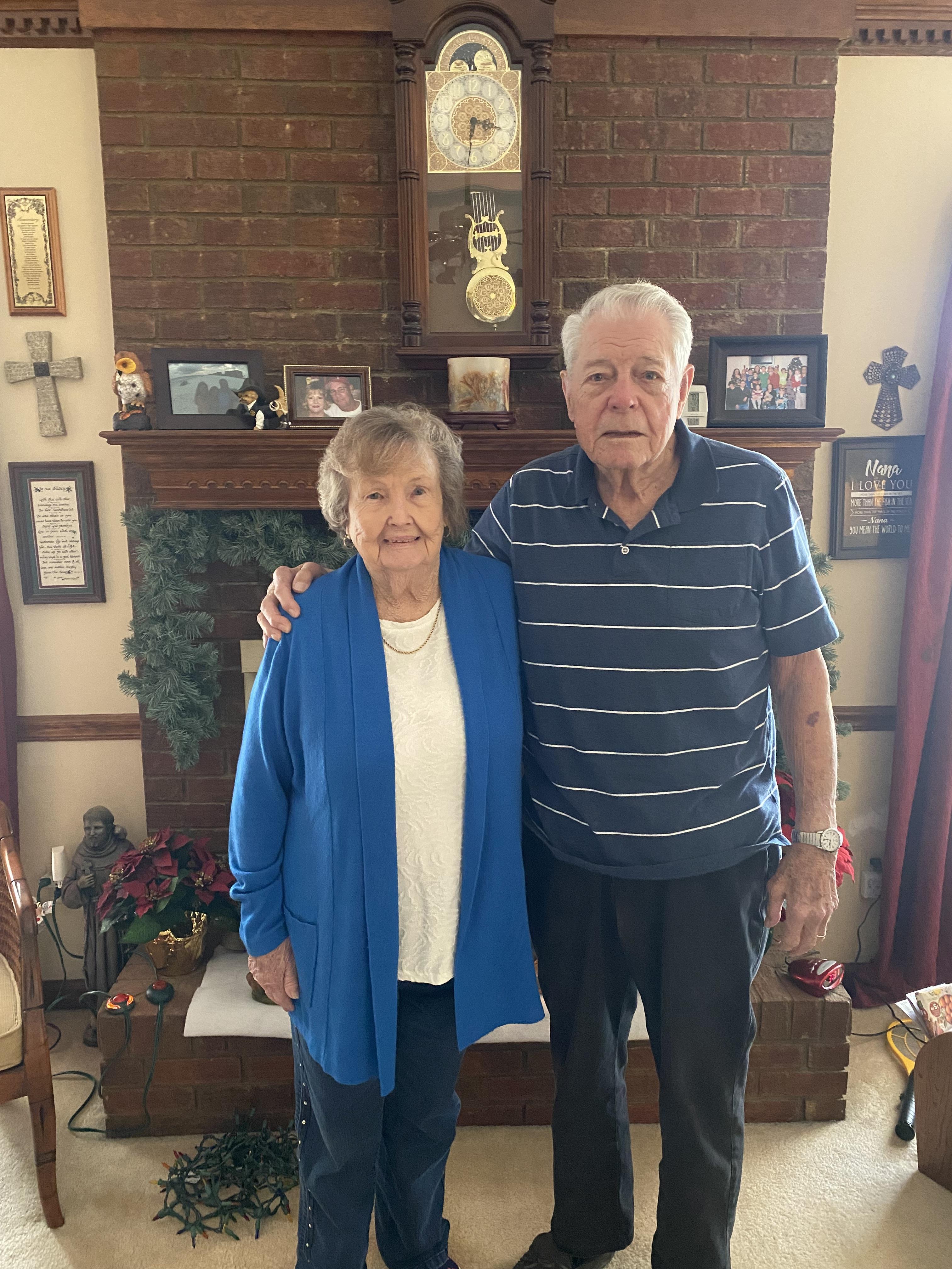 A man and woman standing in a room