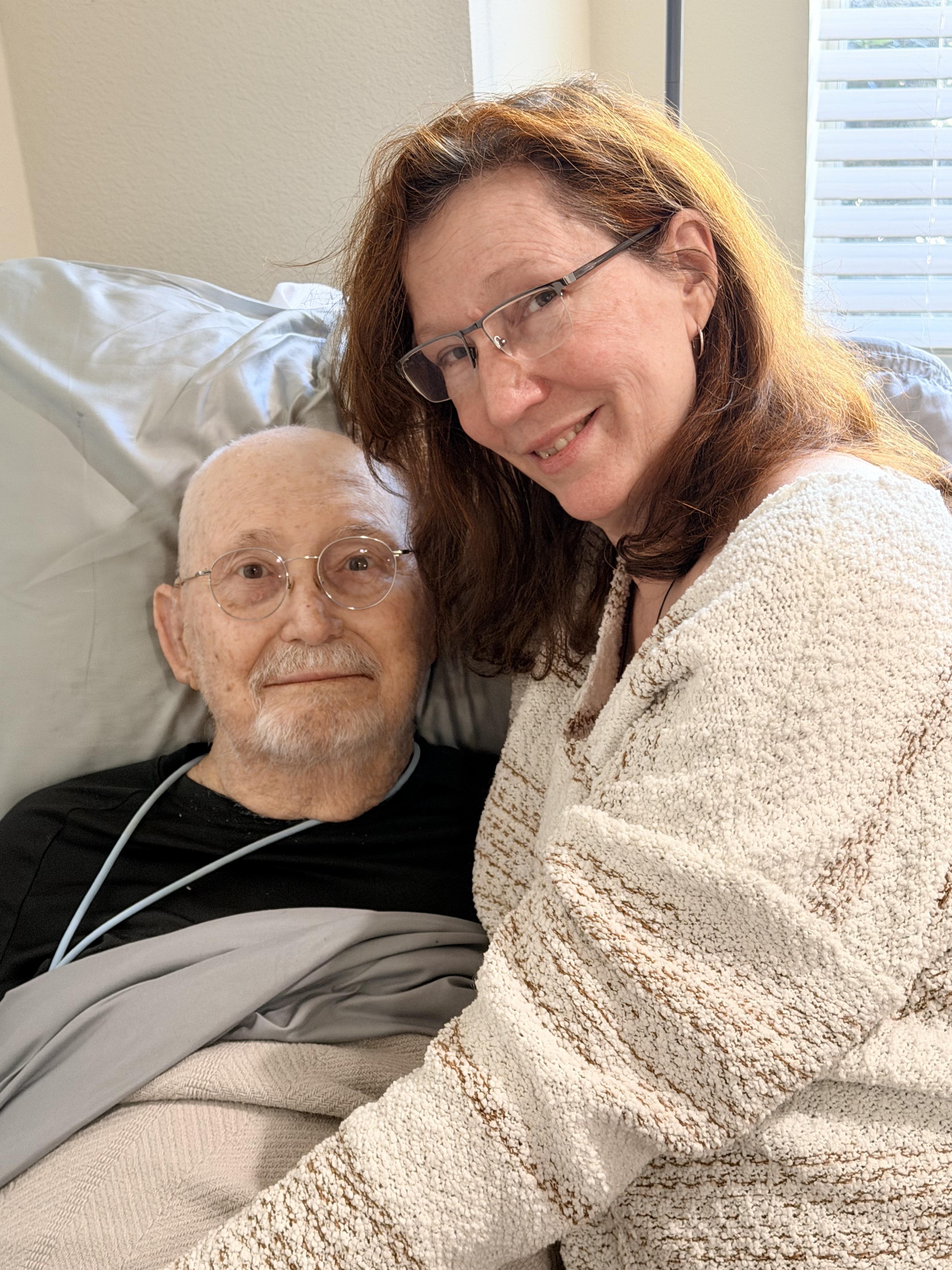 A woman and man lying in bed
