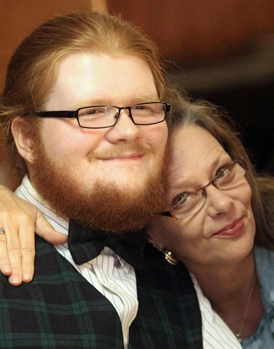 A man and woman smiling