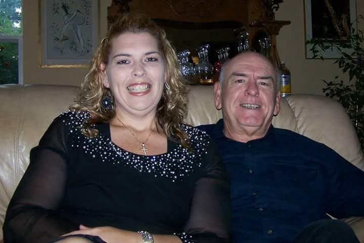 A man and woman sitting on a couch