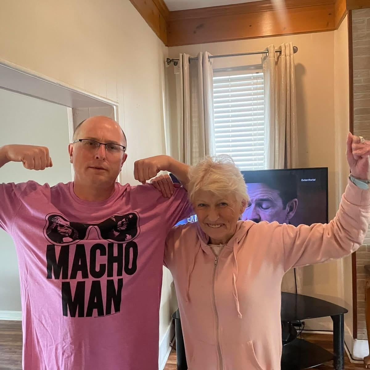 A man and woman posing for a picture