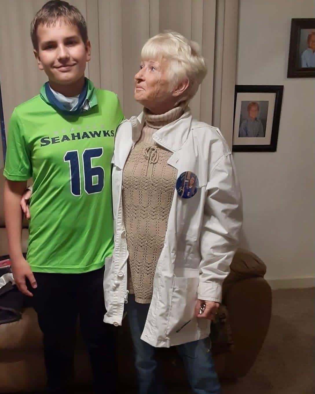 A woman and boy standing next to each other