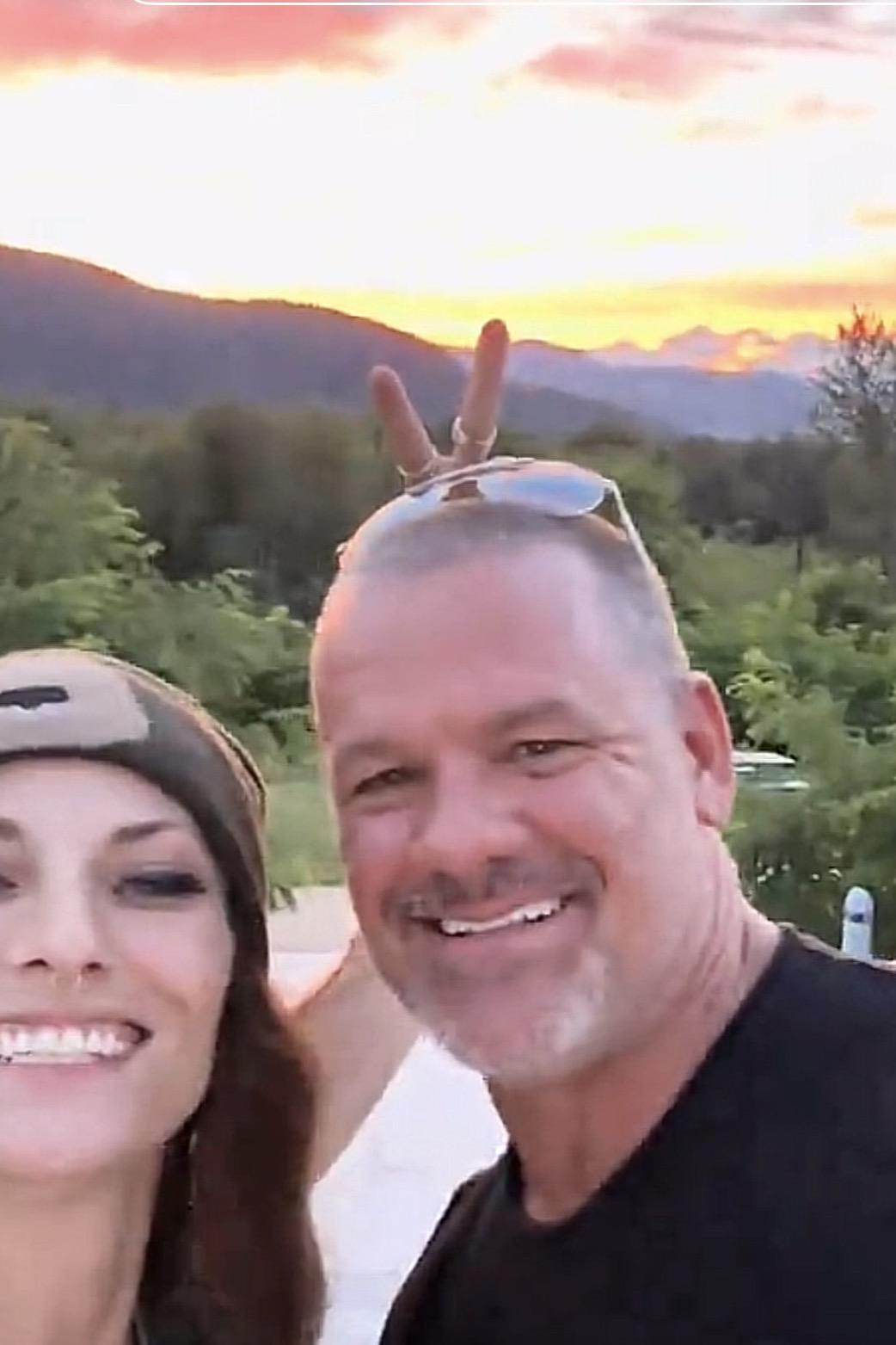 A man and woman taking a selfie
