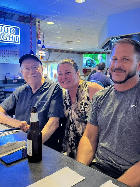 A group of people sitting at a table