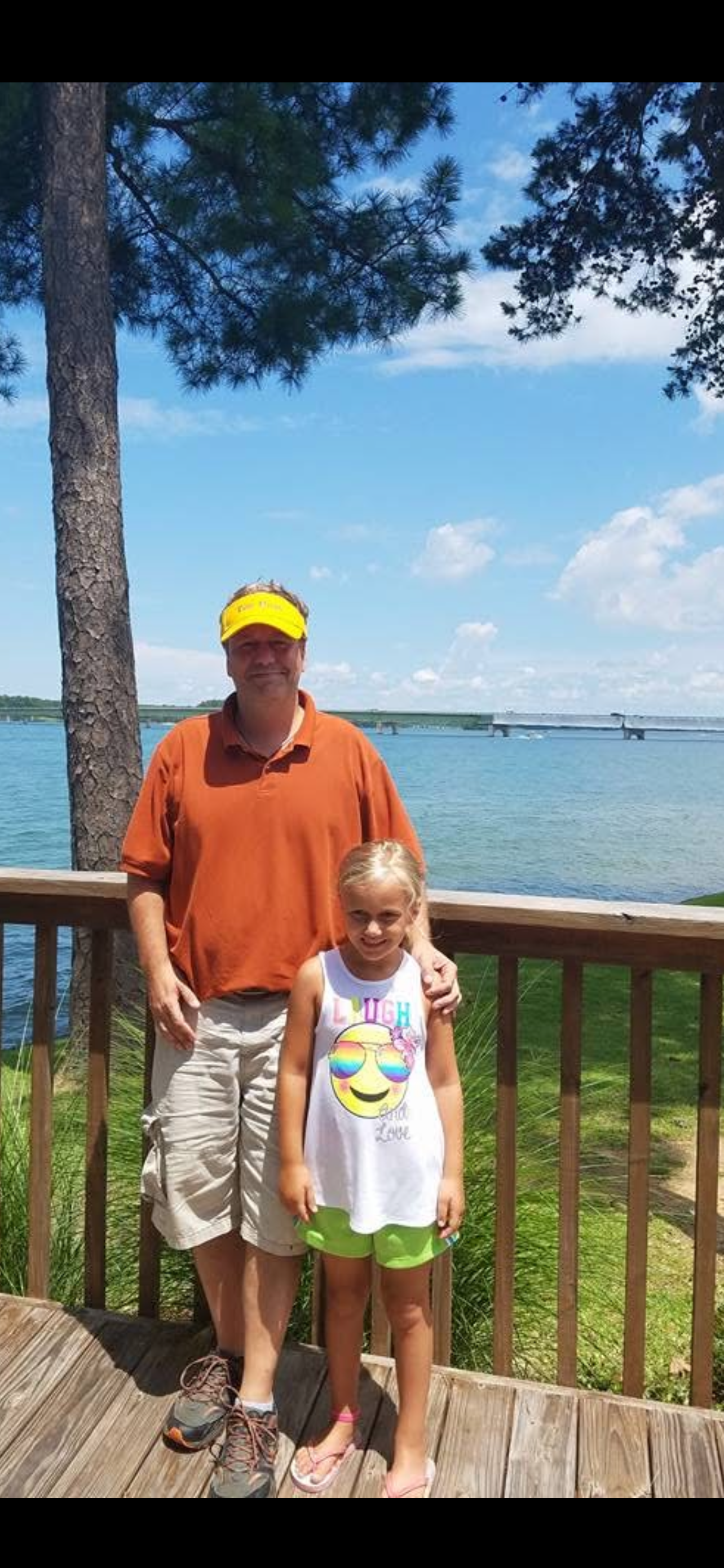 A man and a girl posing for a picture