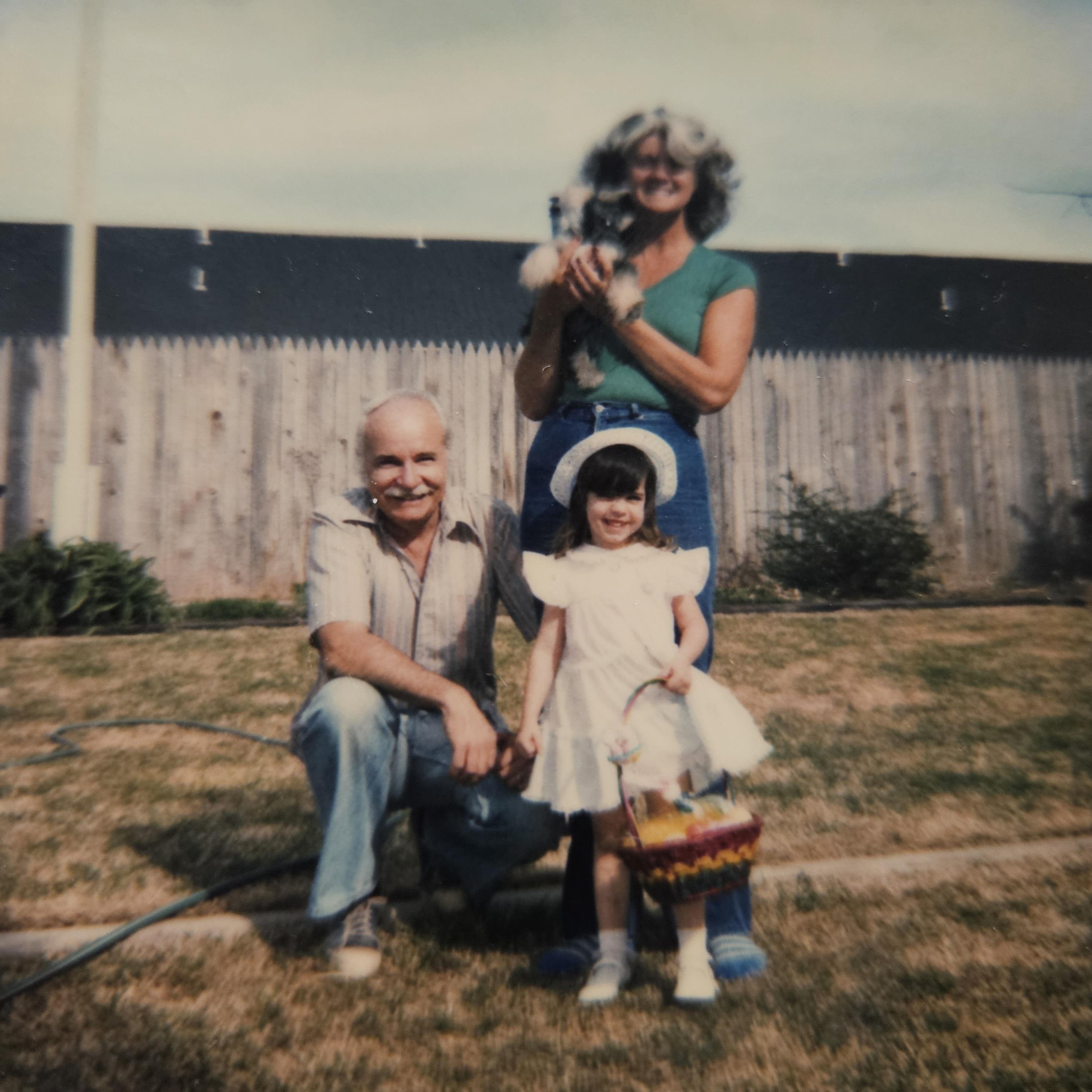 A man and woman with a dog and a dog