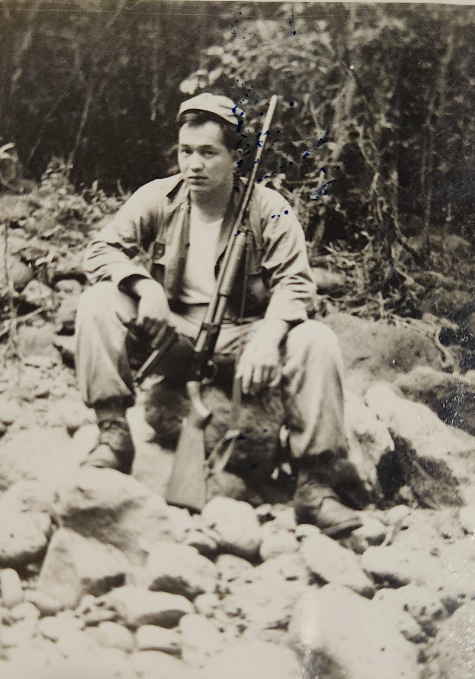 A man holding a rifle