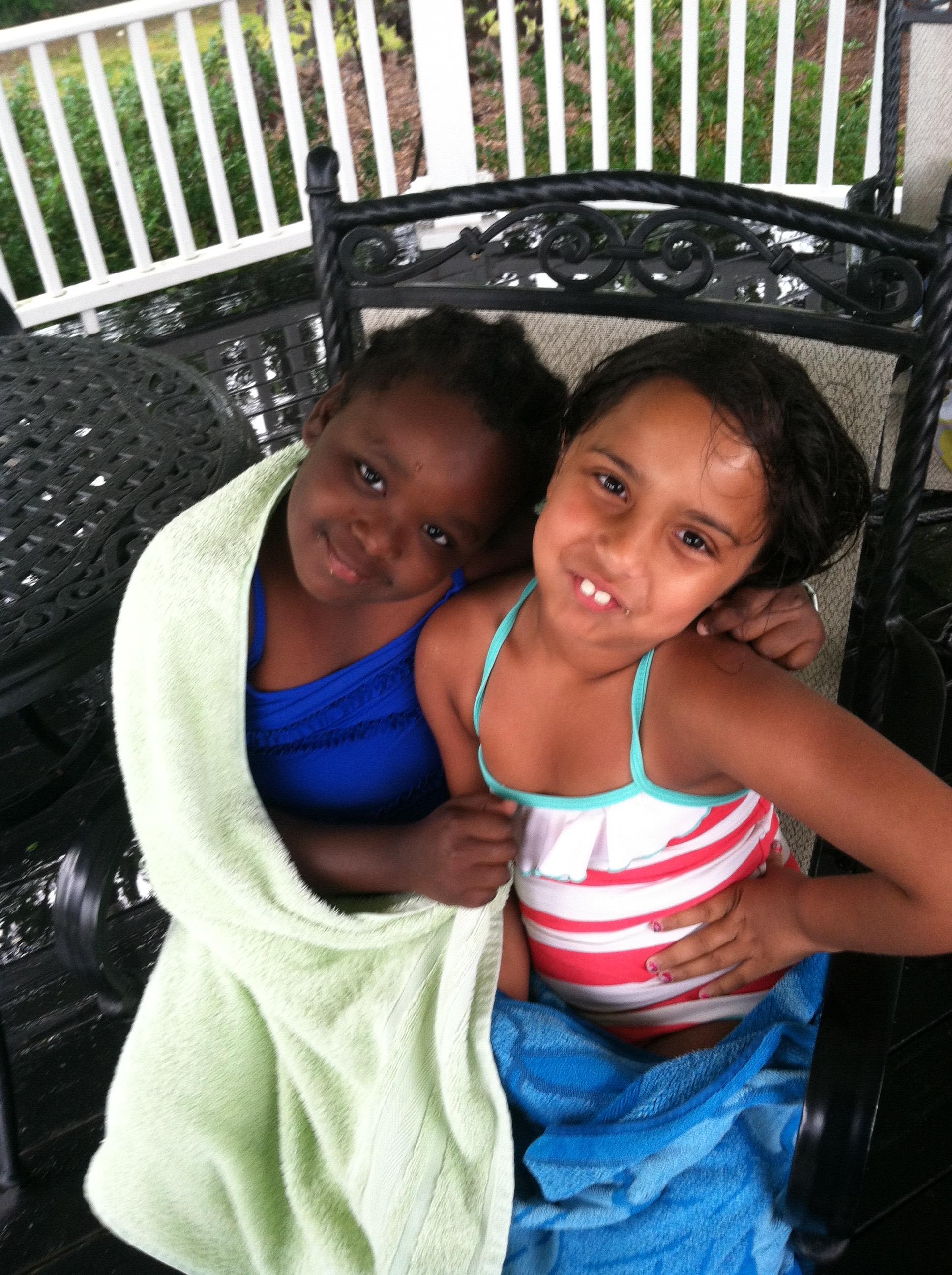 Two girls sitting on a chair