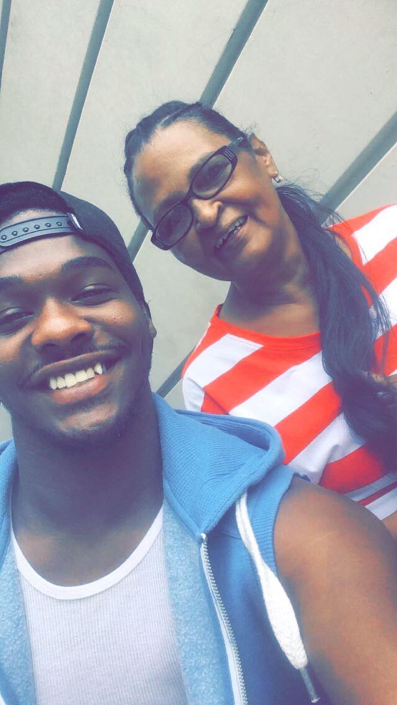 A man and woman smiling for a selfie