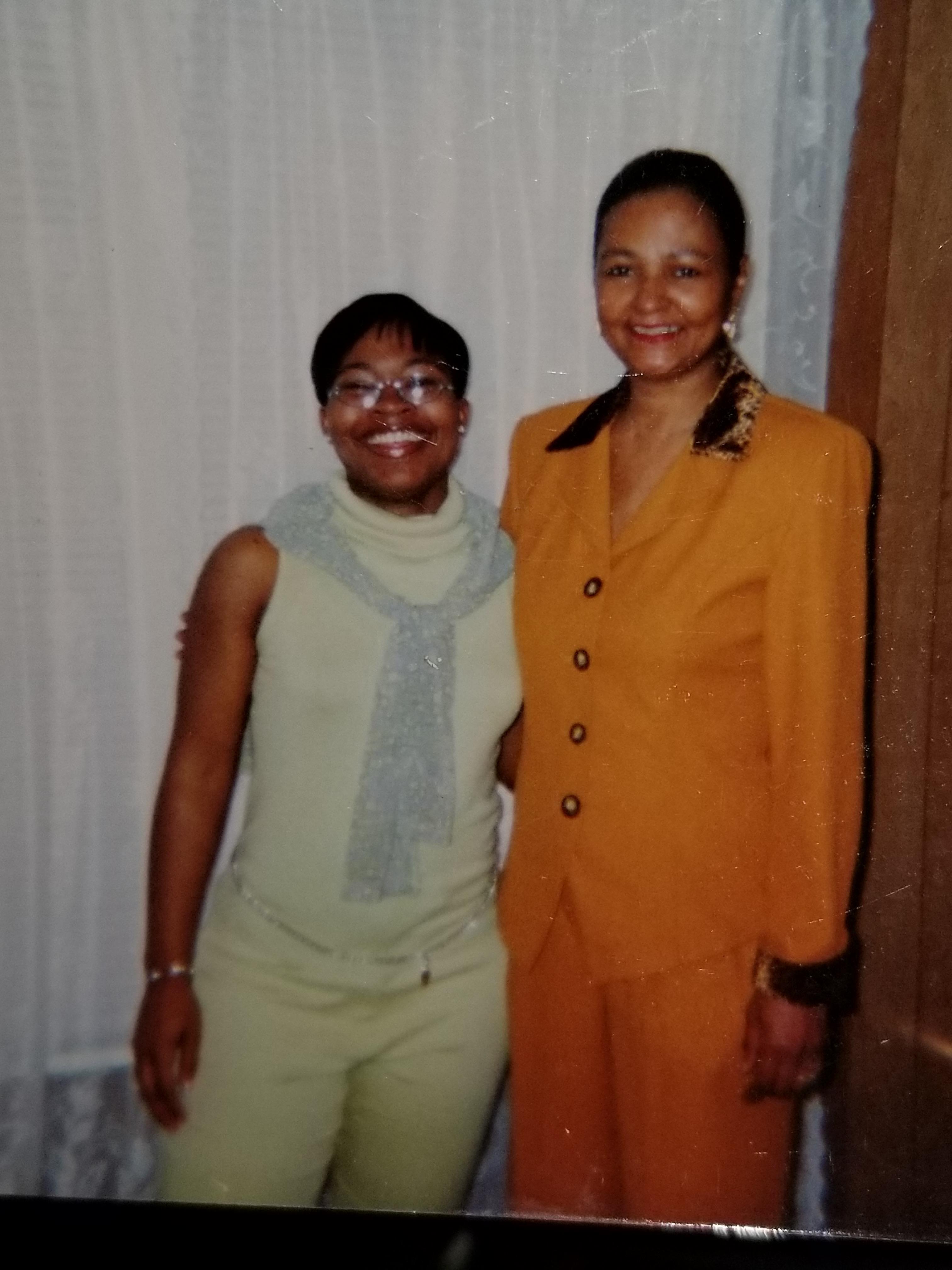 A couple of women standing together