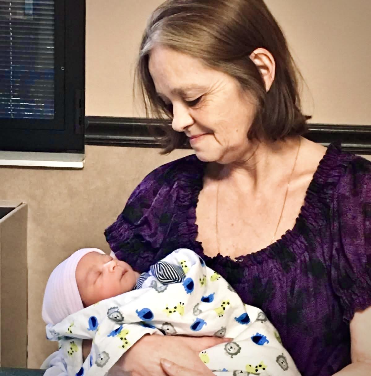 A woman holding a baby