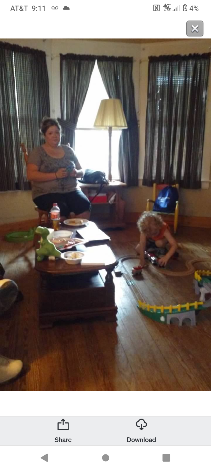 A woman and child playing with toys