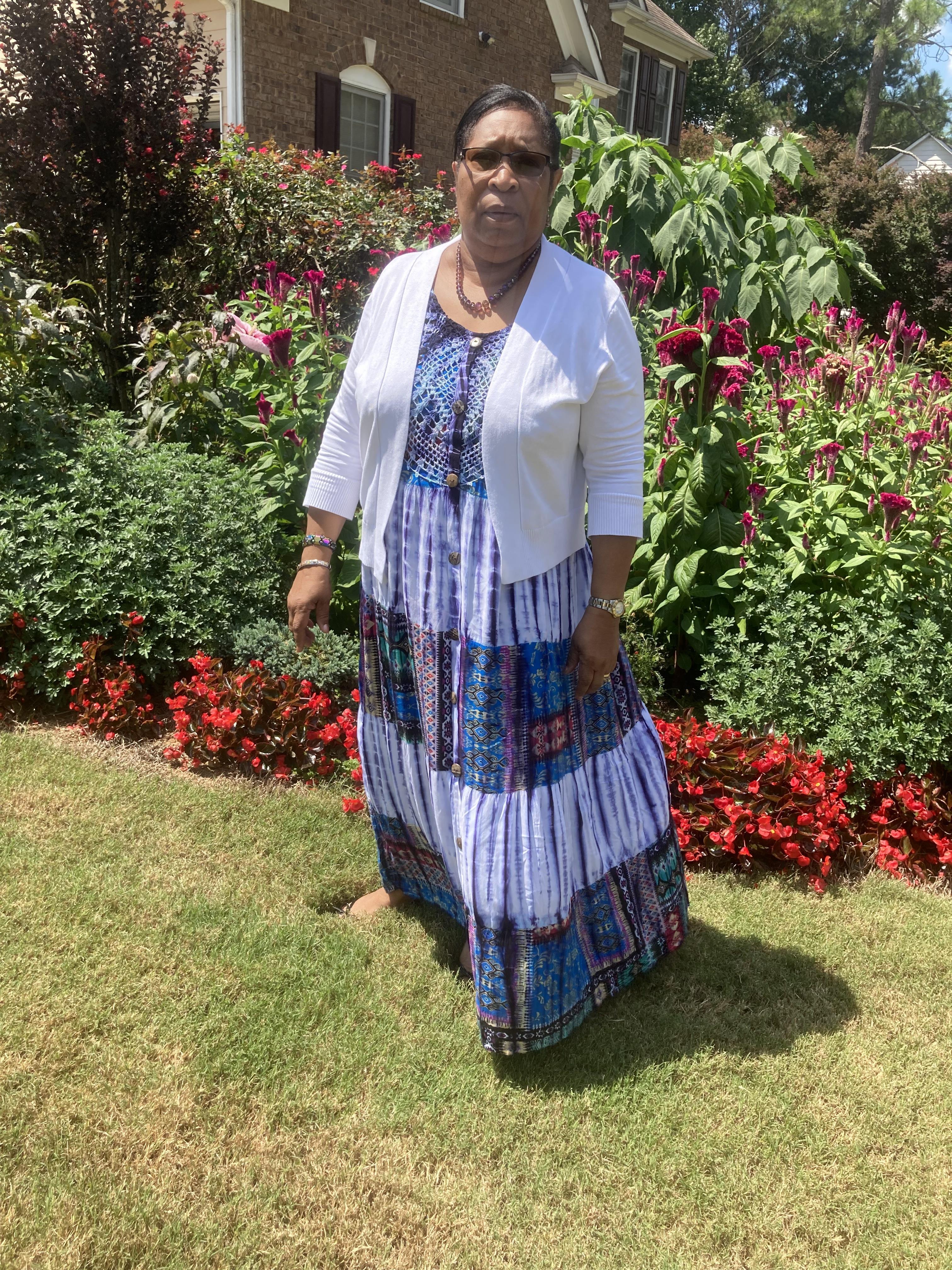 A woman standing in a garden
