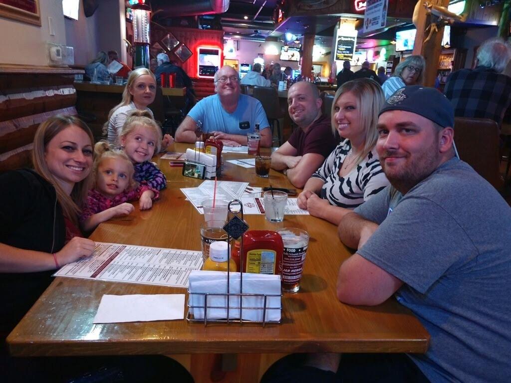 A group of people sitting at a table