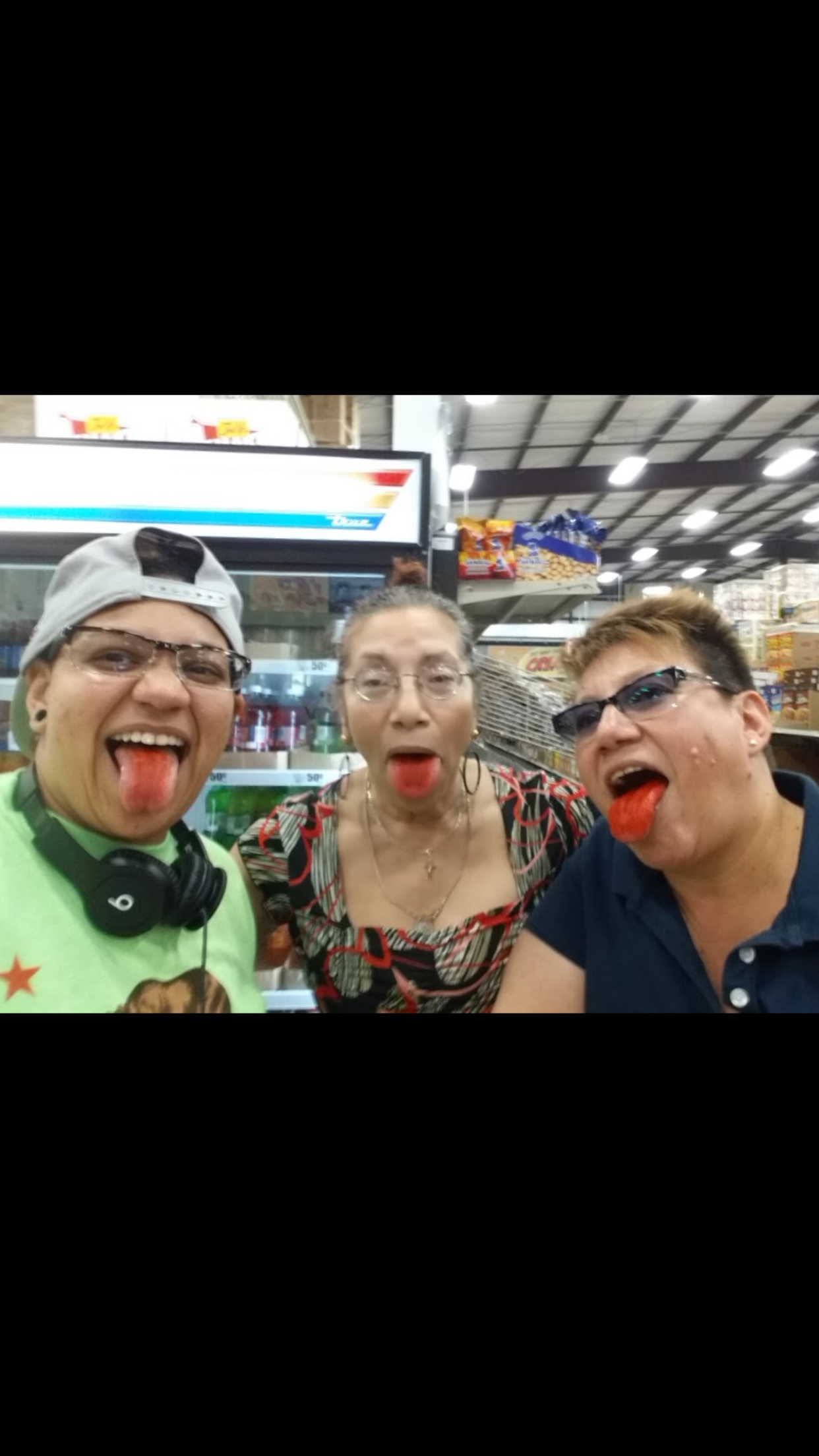 A group of people sticking their tongue out