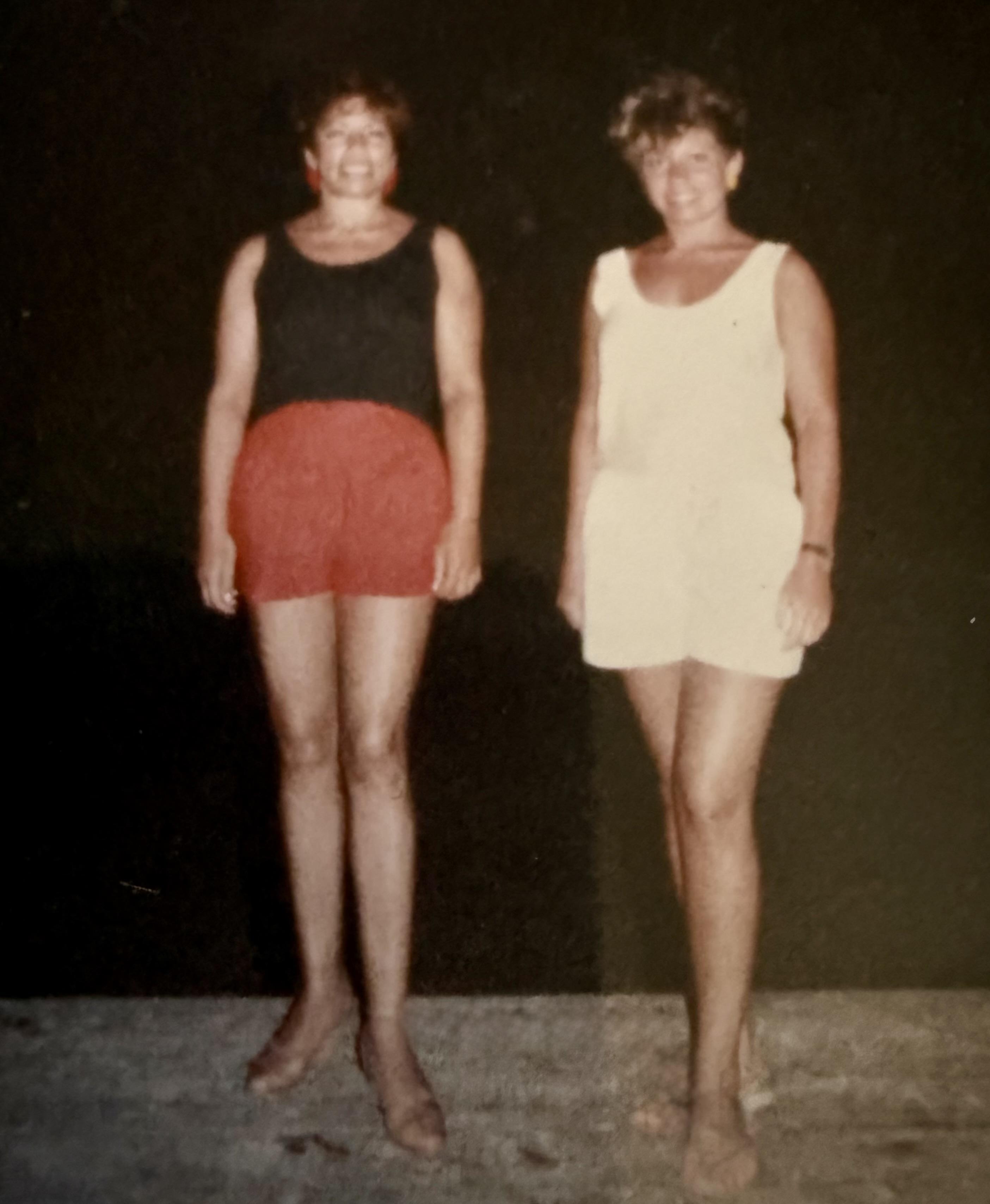 Two women standing together smiling