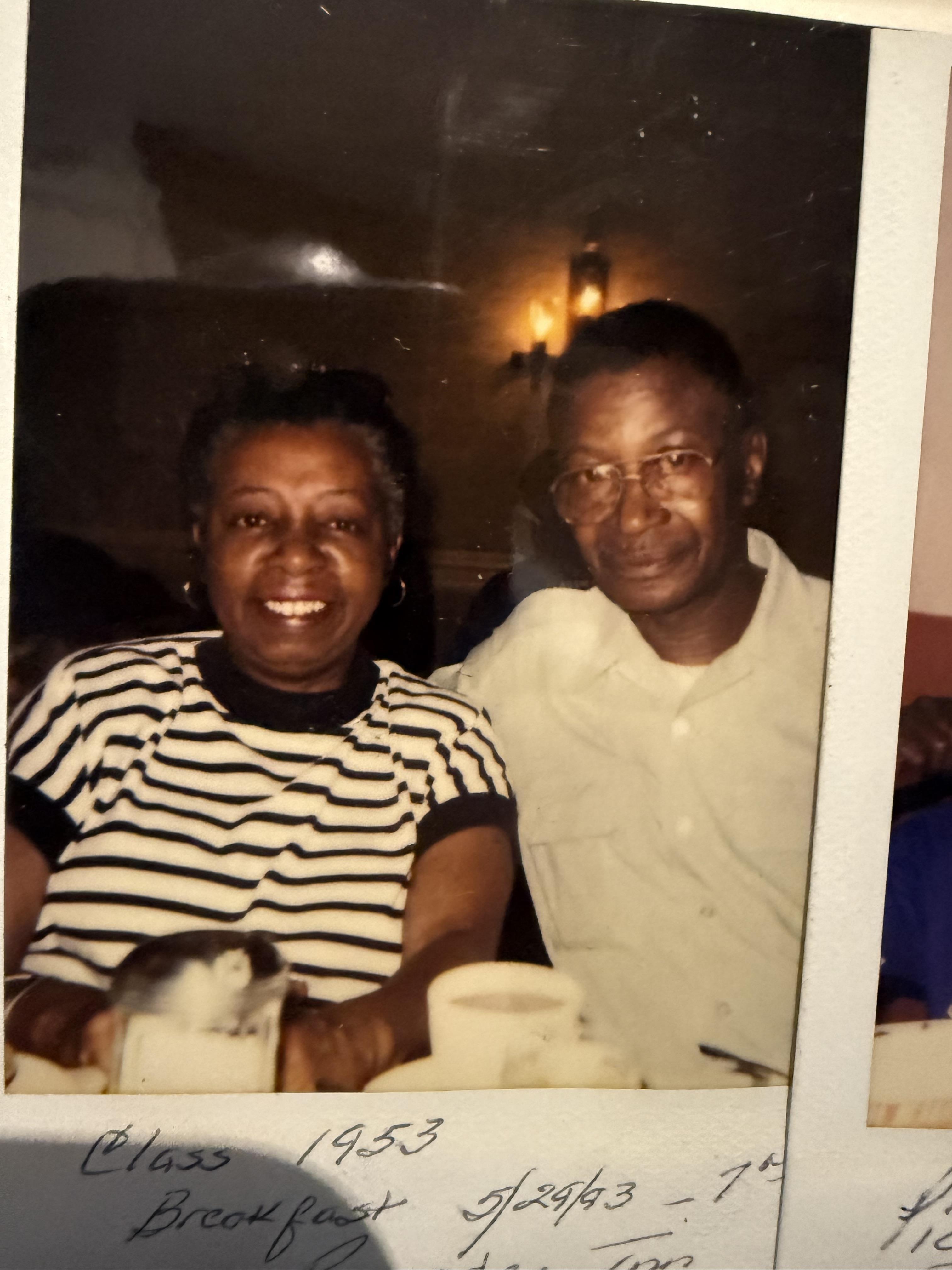 A man and woman sitting at a table