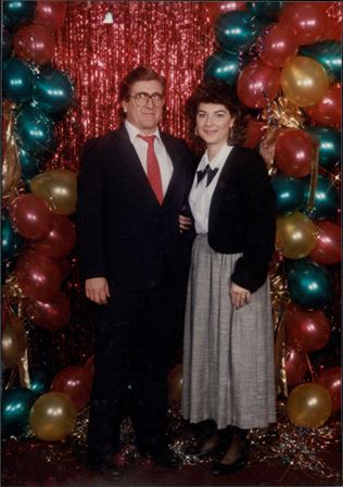 A man and woman posing for a picture
