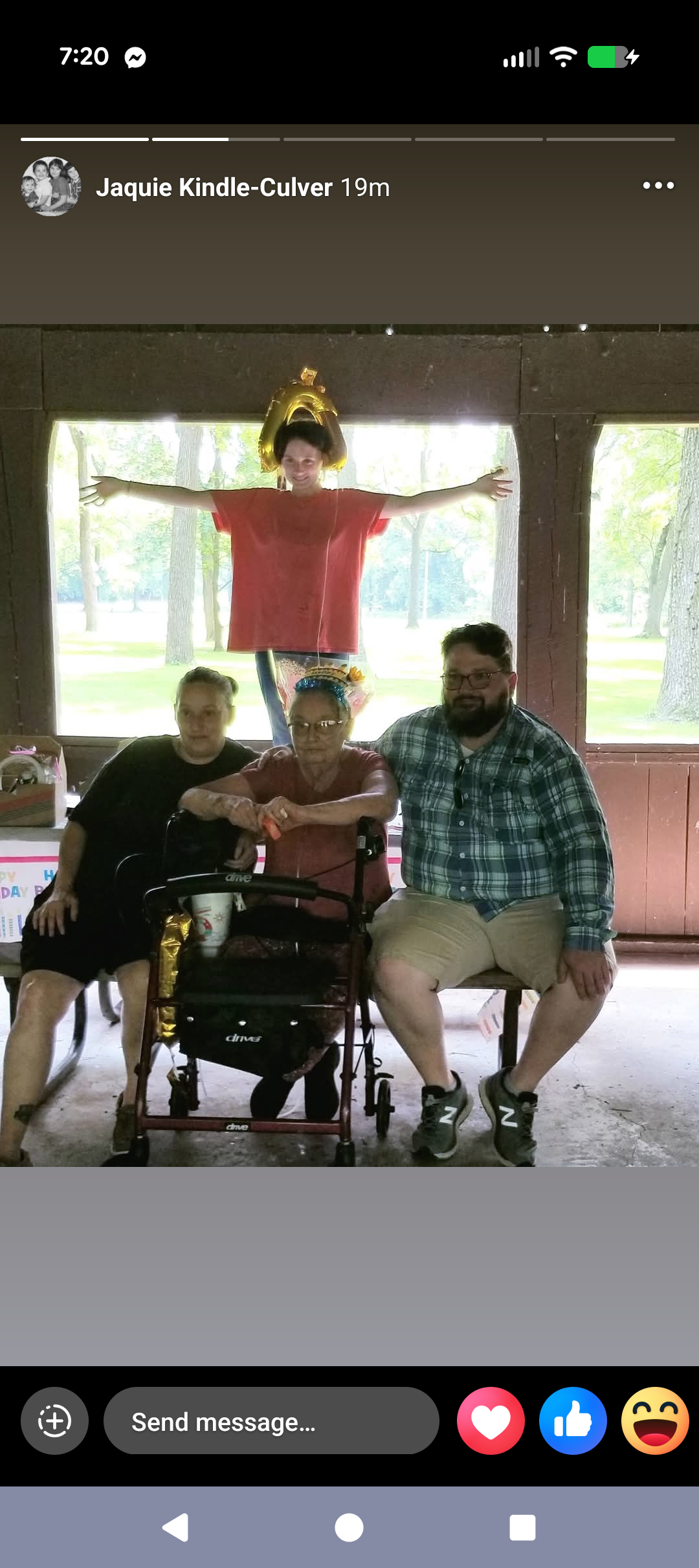 A group of people sitting in a chair