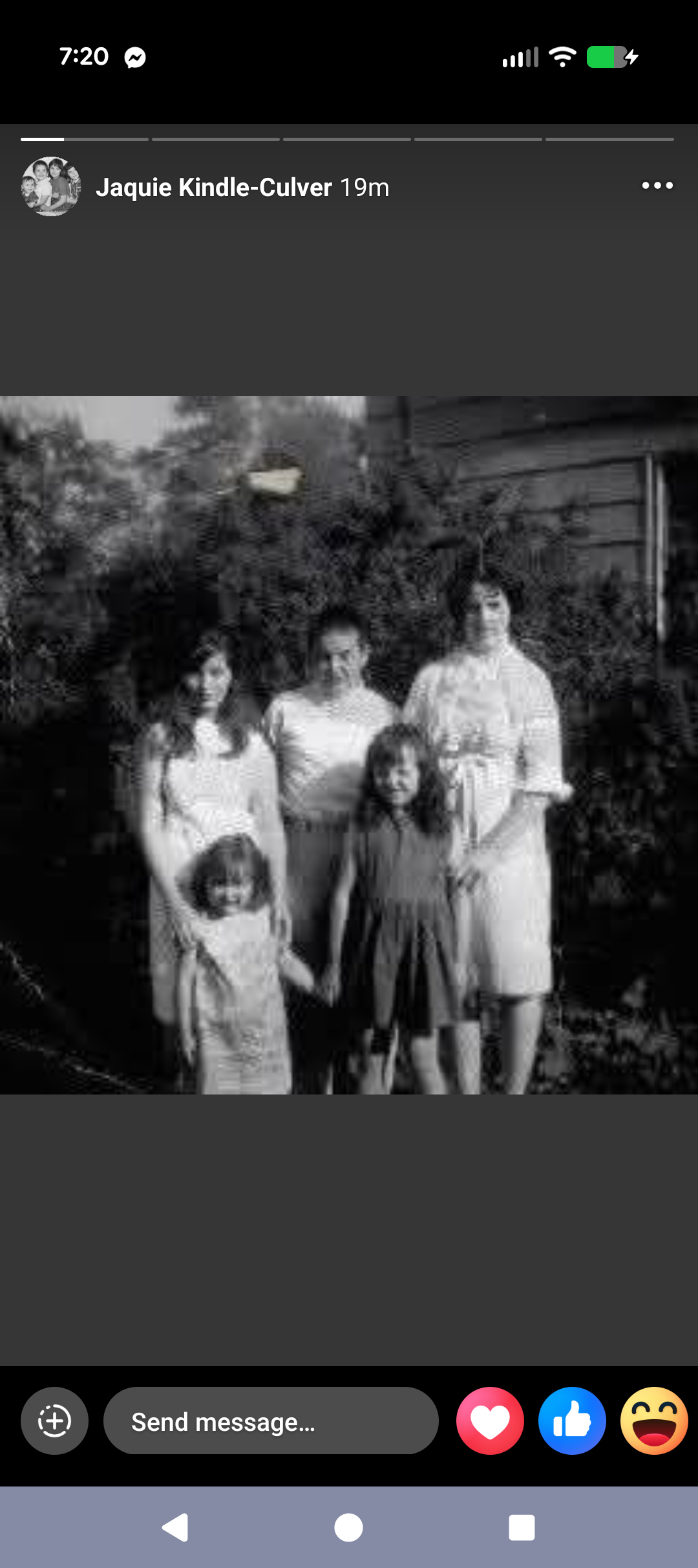 A group of women and children posing for a photo
