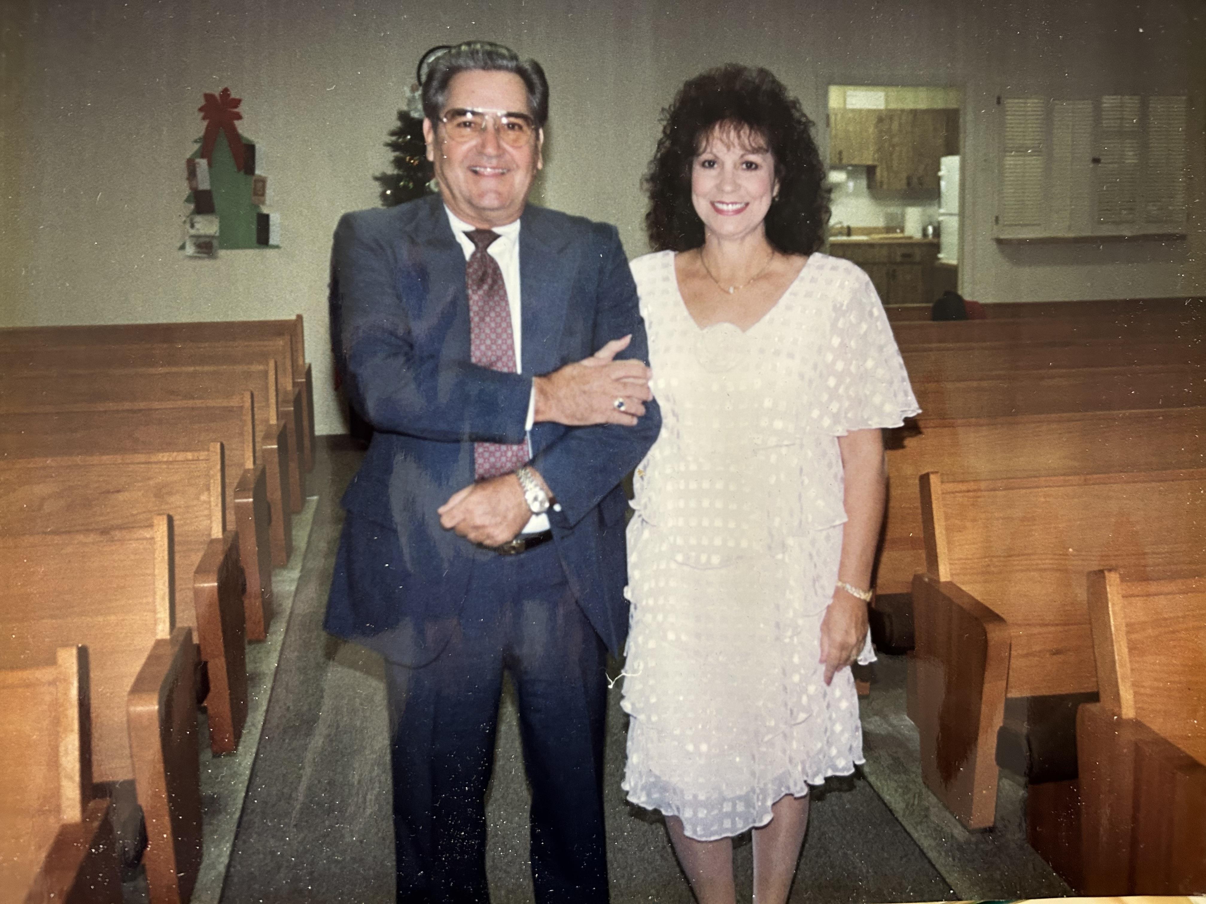 A man and woman standing in a church