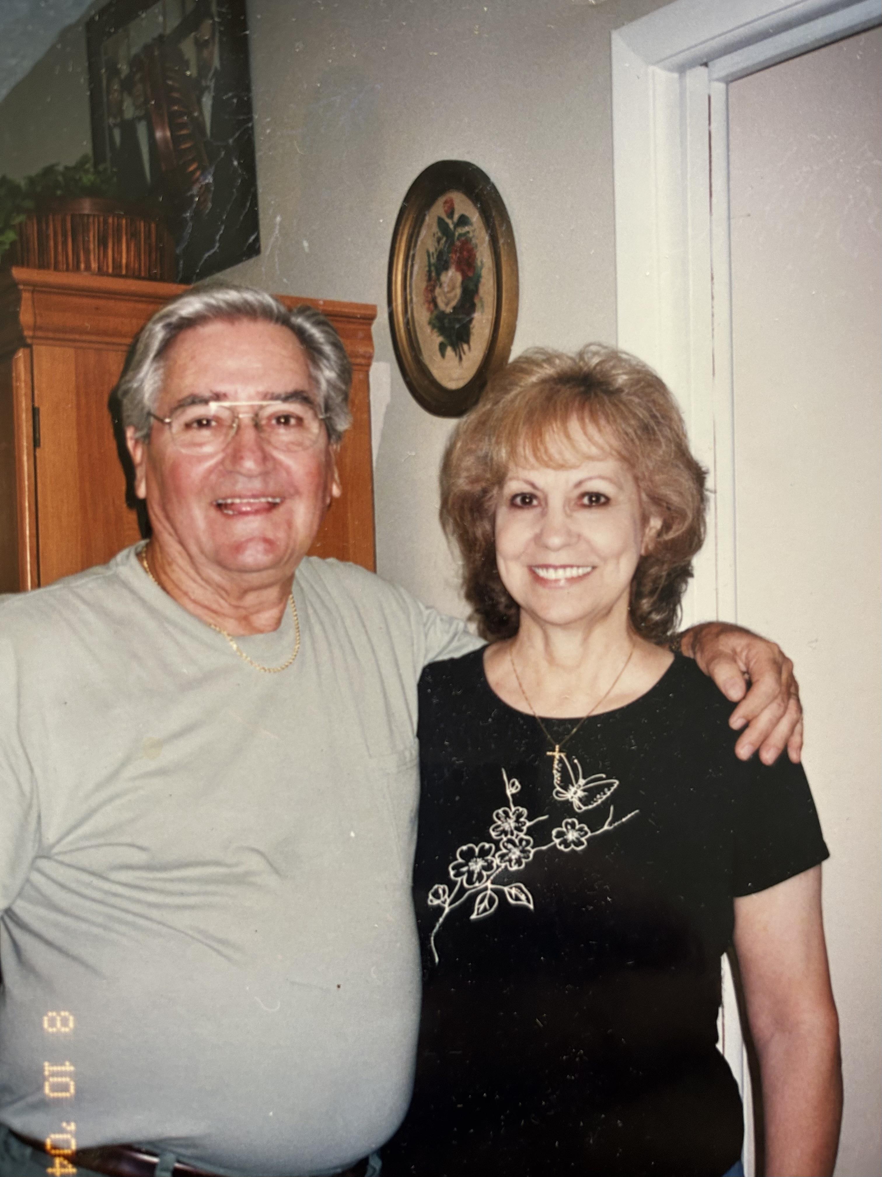 A man and woman posing for a picture
