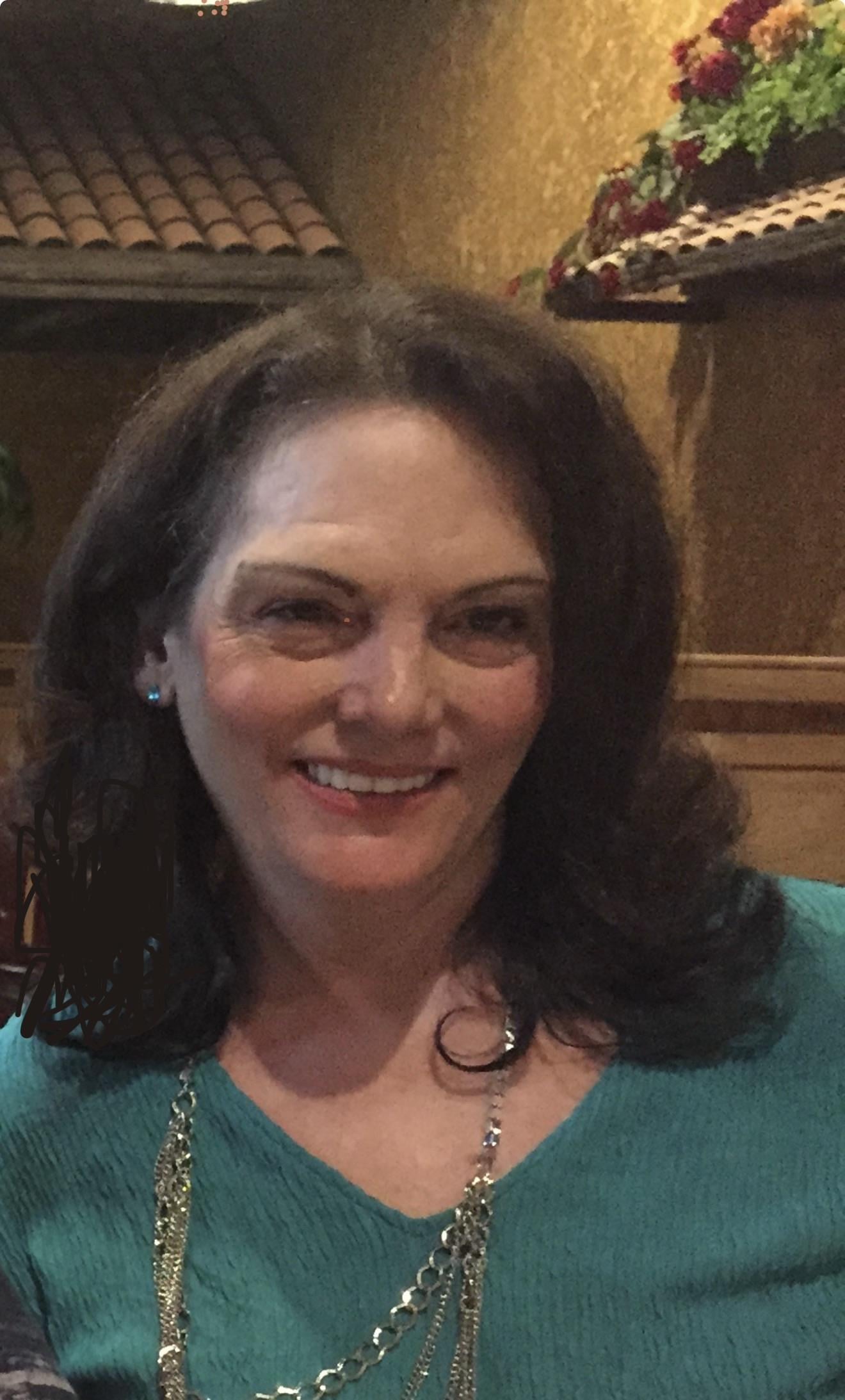 A woman smiling at the camera