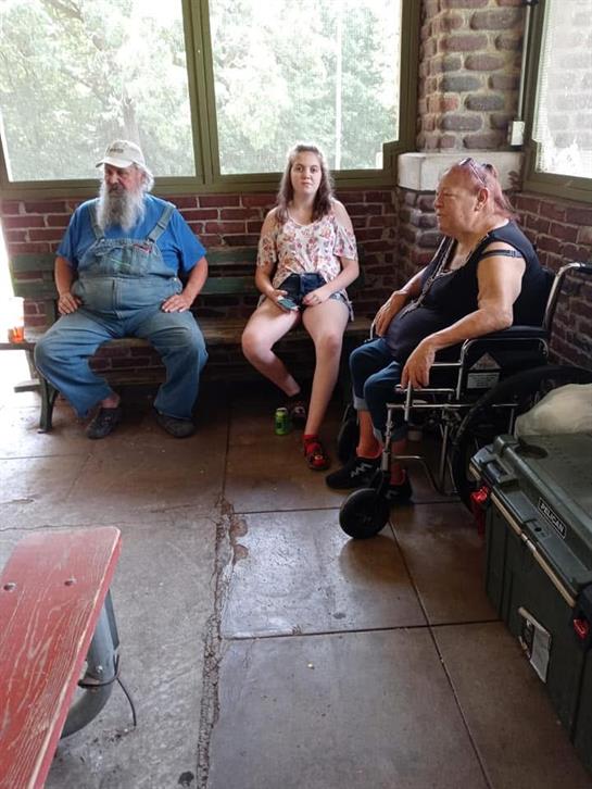 A group of people sitting on benches