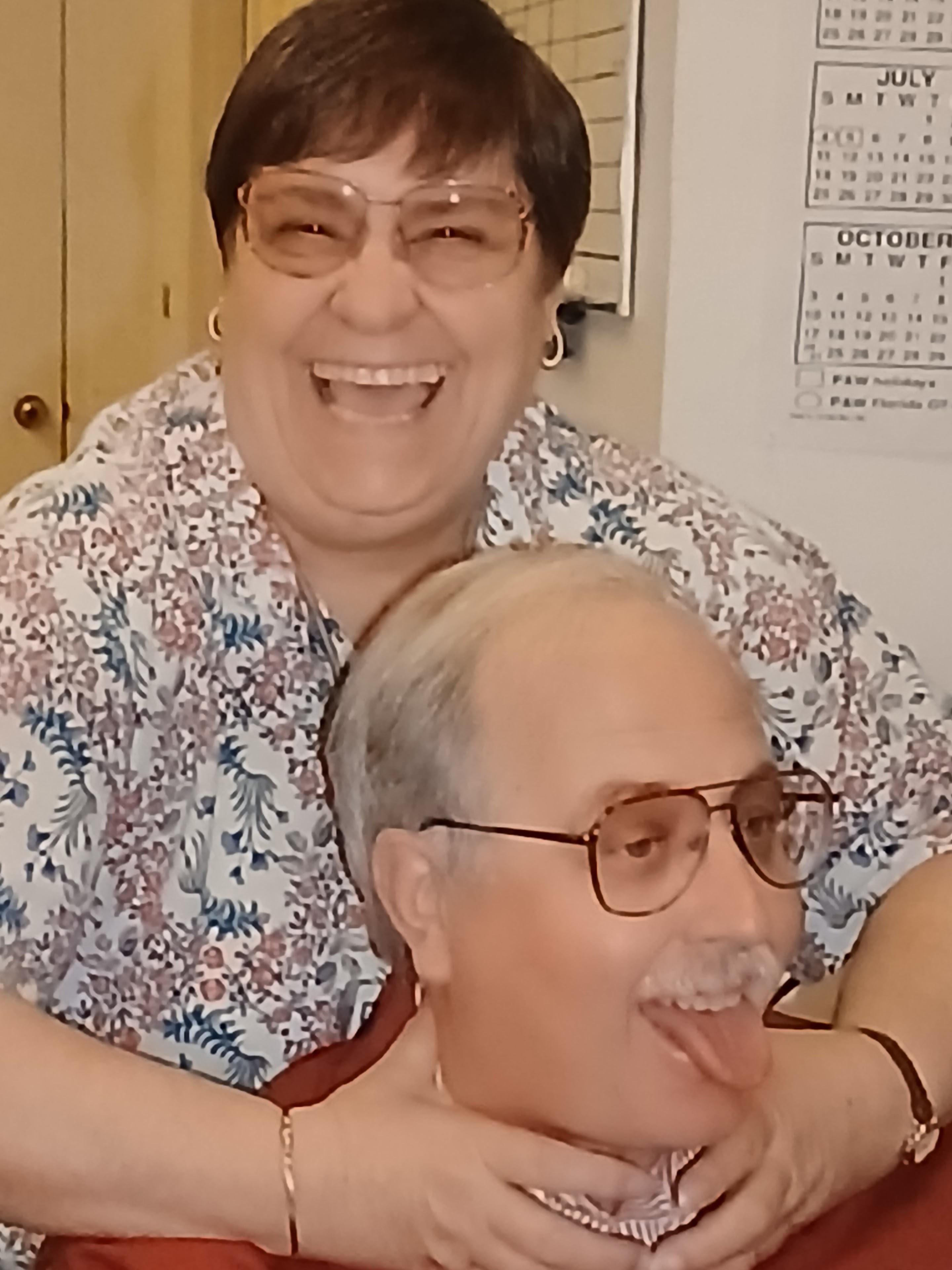A man and woman smiling