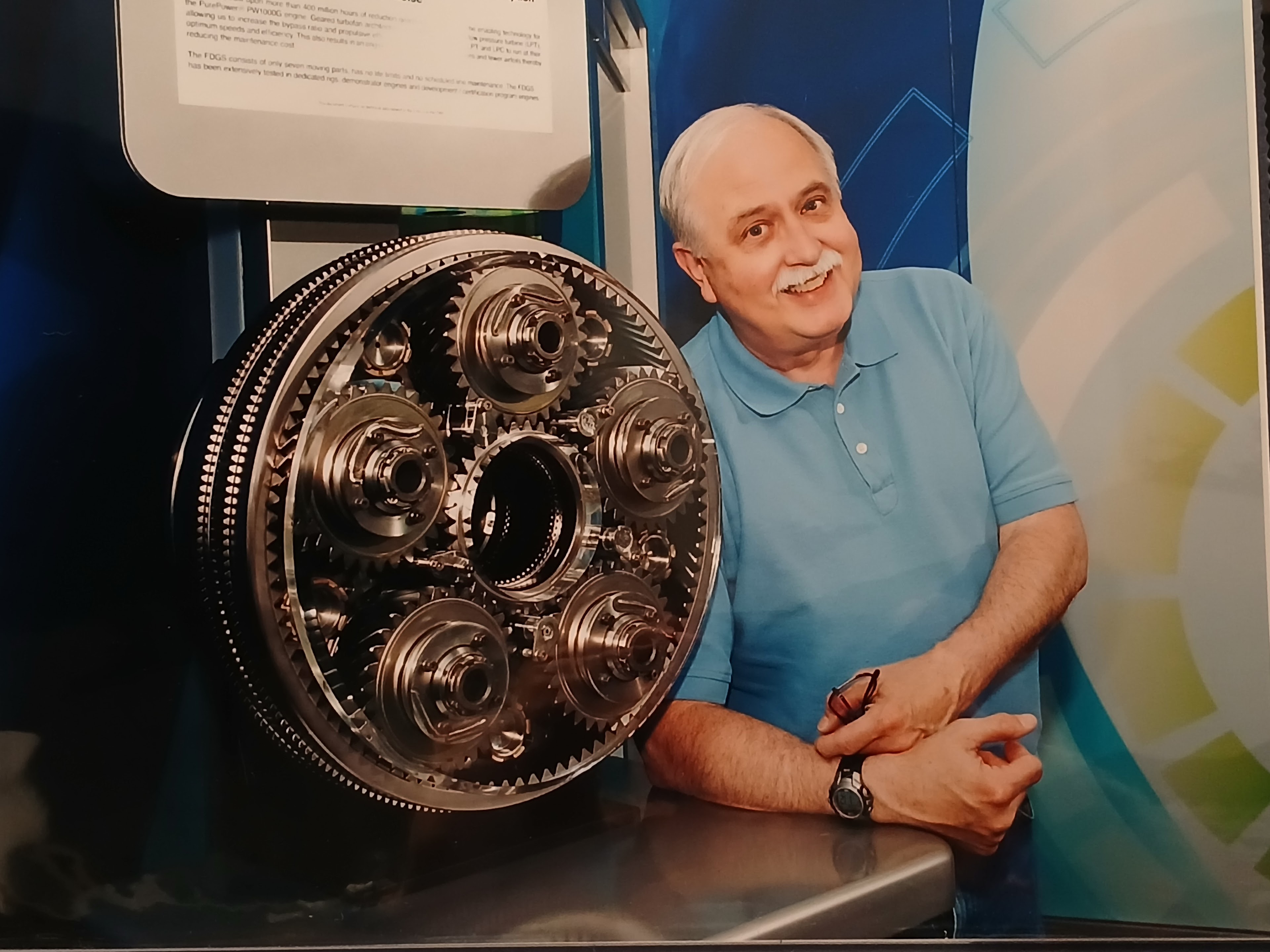 A man standing next to a large metal machine