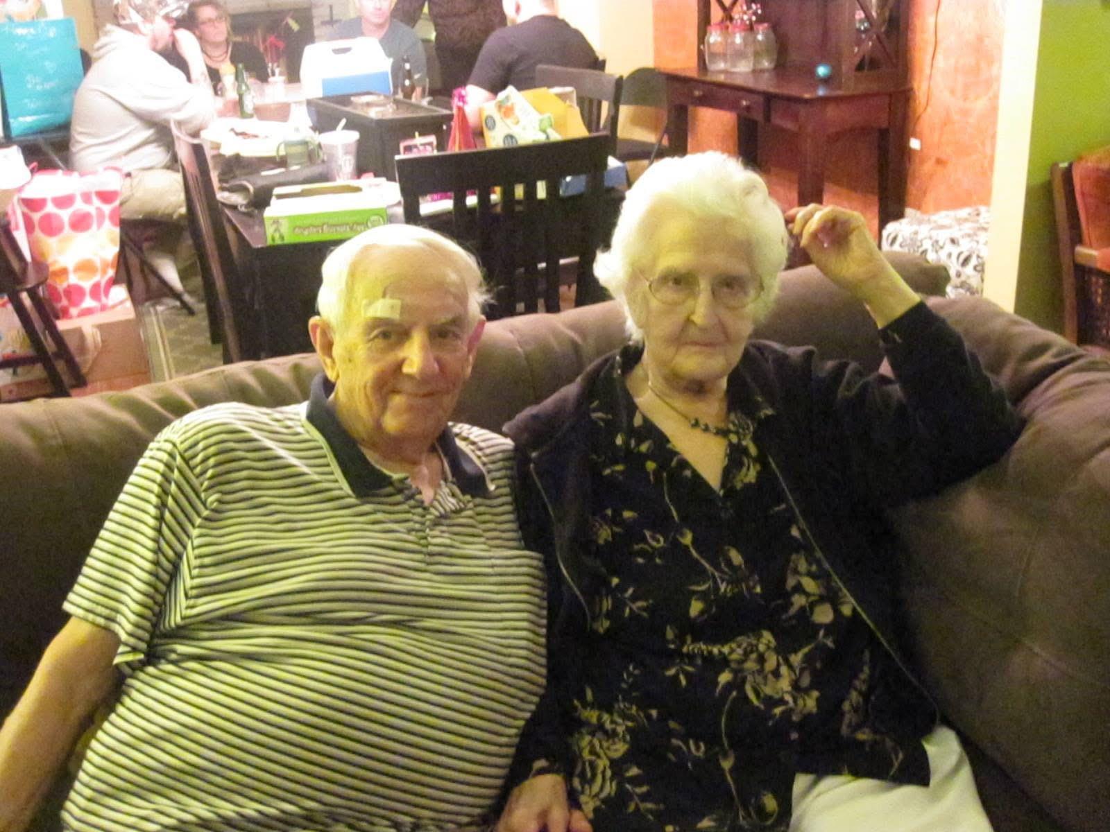 A man and woman sitting on a couch