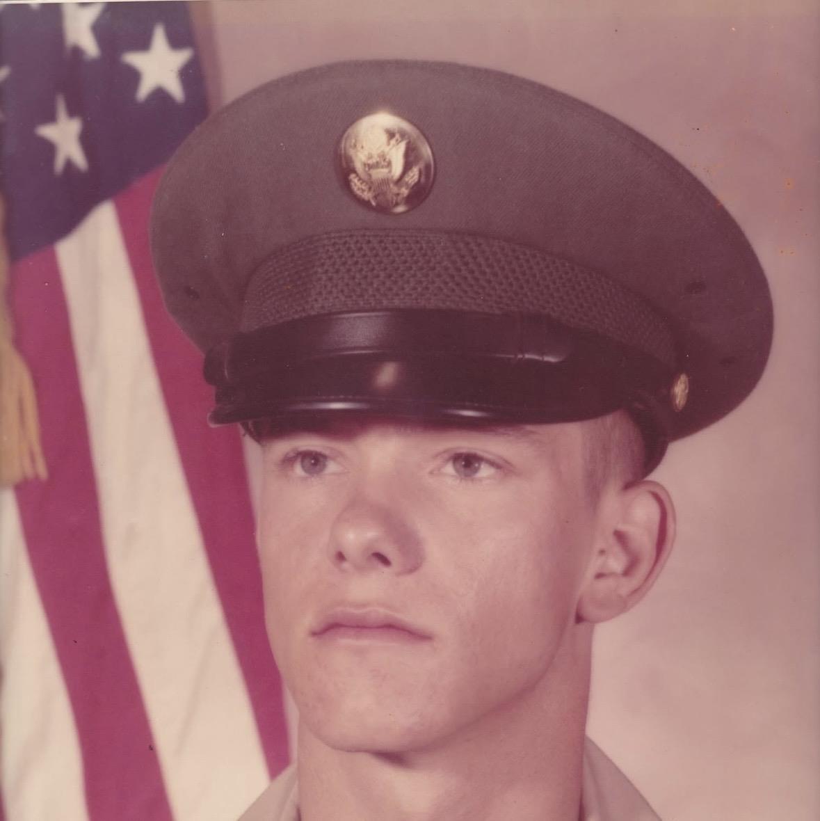 A man in uniform with a hat