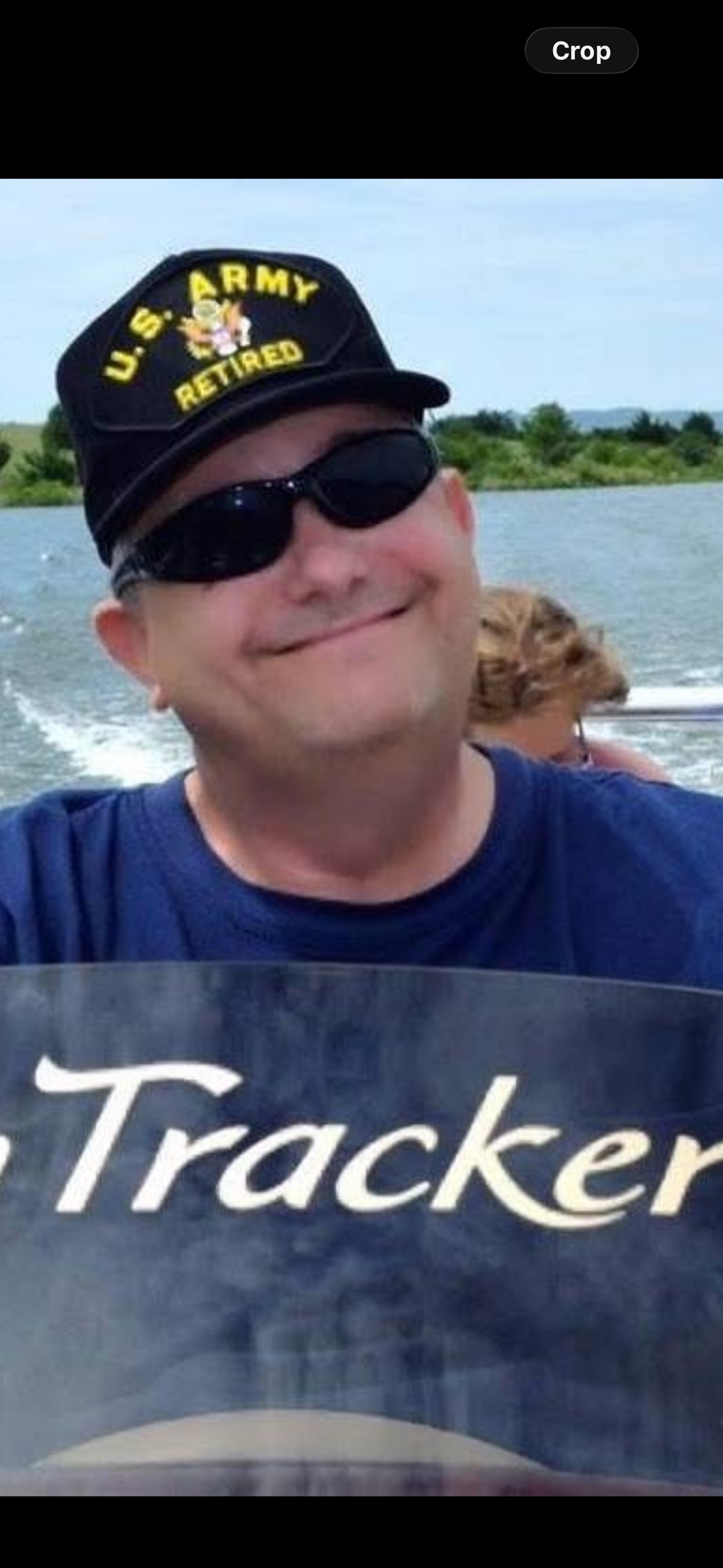 A man wearing sunglasses and a hat