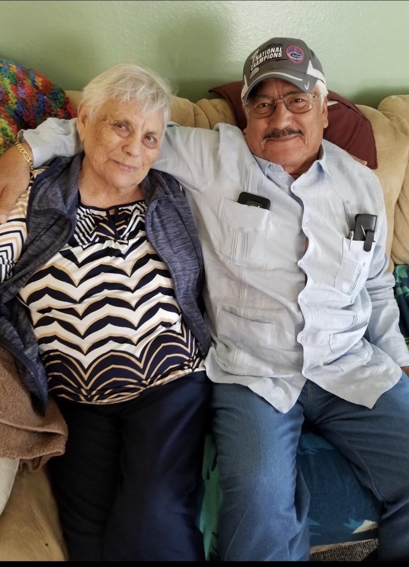 A man and woman sitting on a couch
