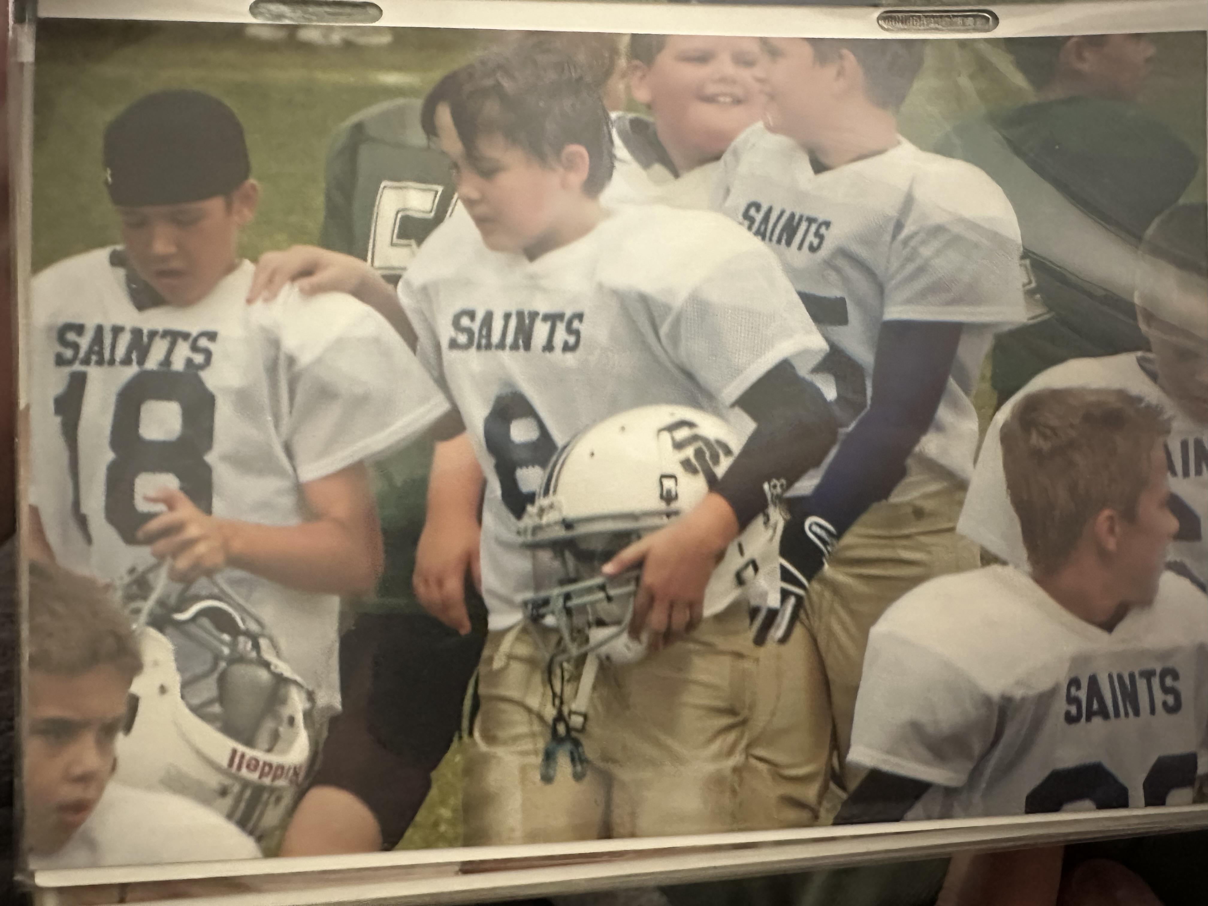 A group of boys wearing football uniforms