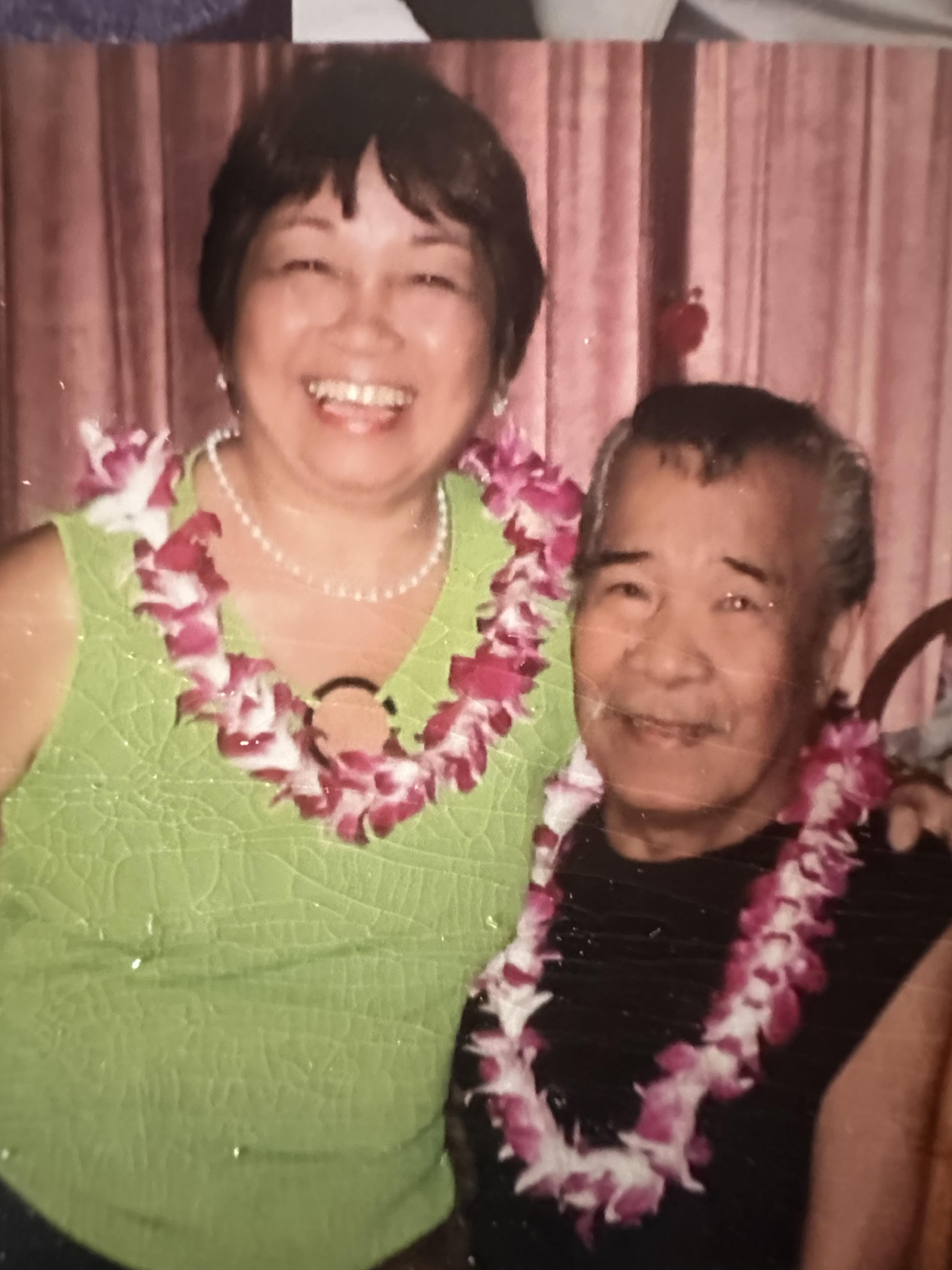 A man and woman posing for a picture
