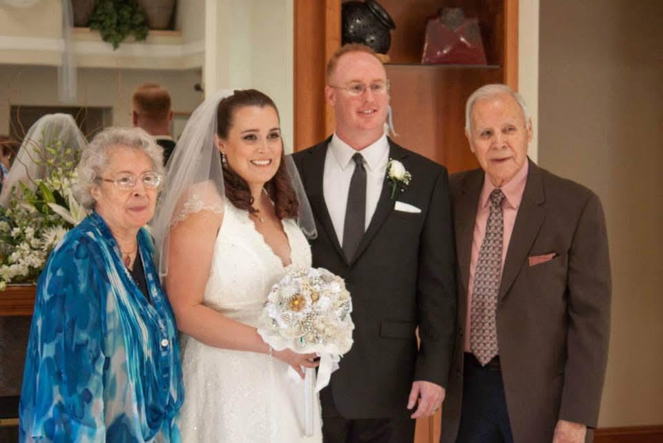 A bride and groom posing for a picture