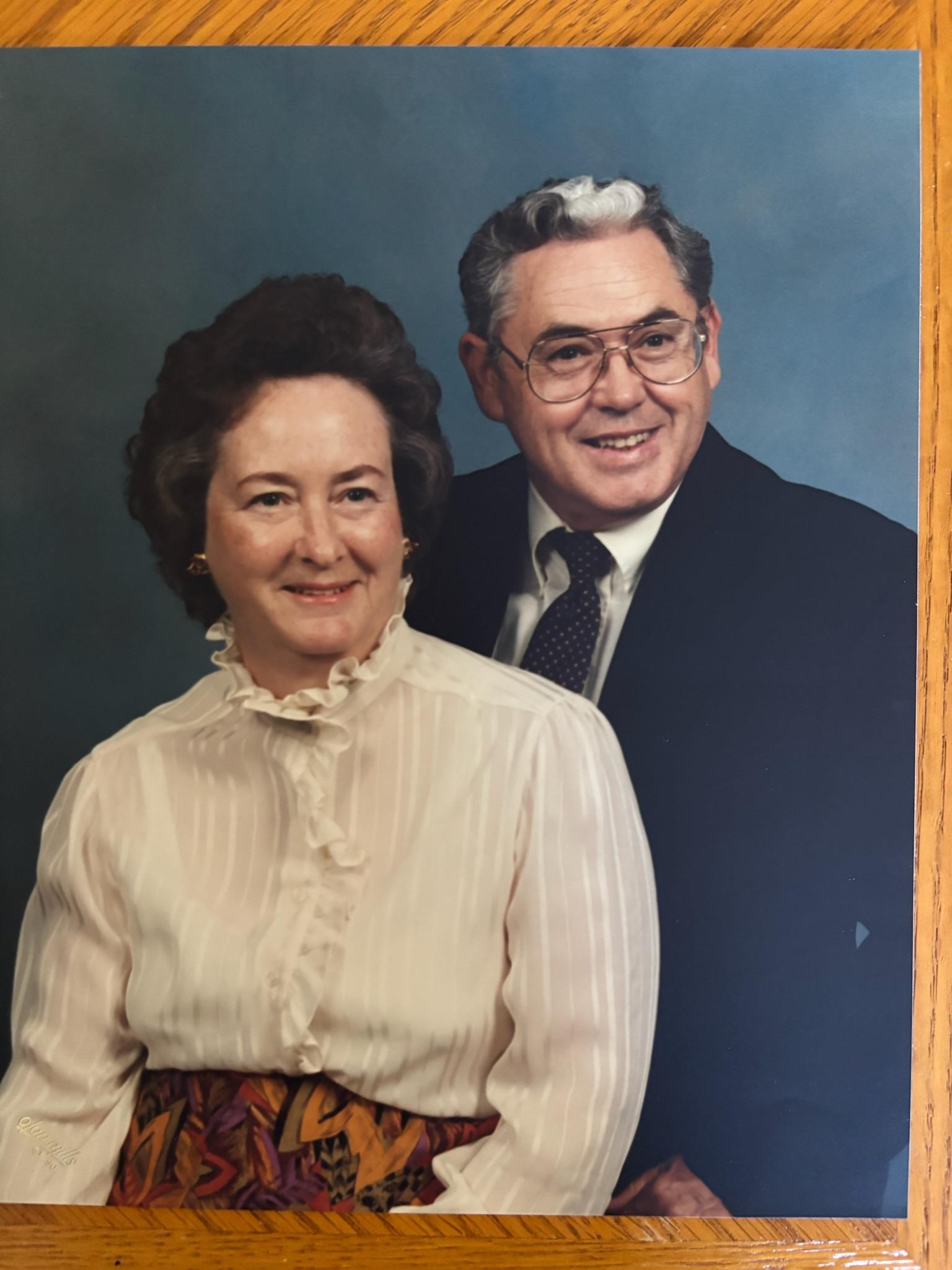 A man and woman posing for a picture