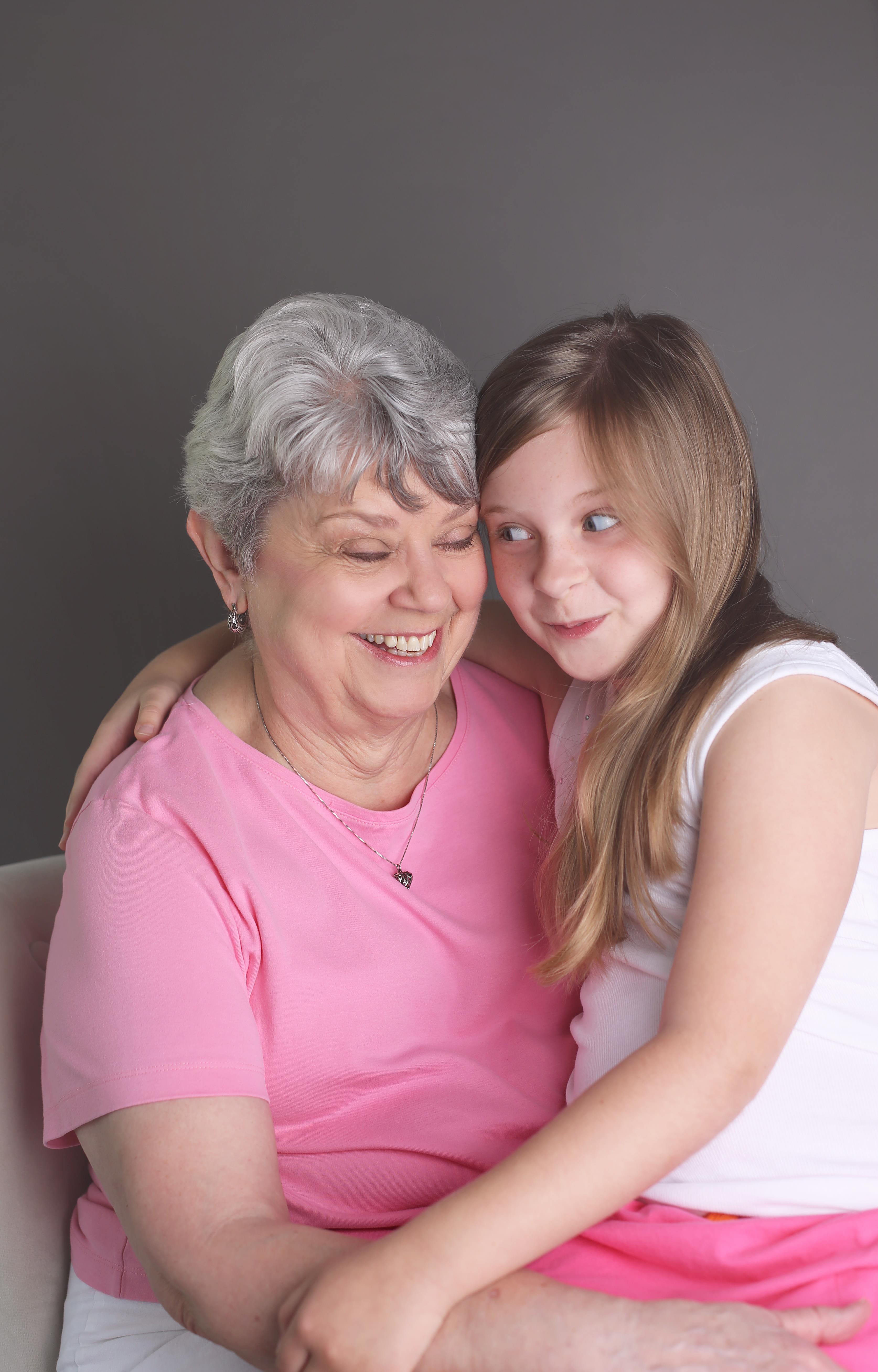 A woman and a girl hugging