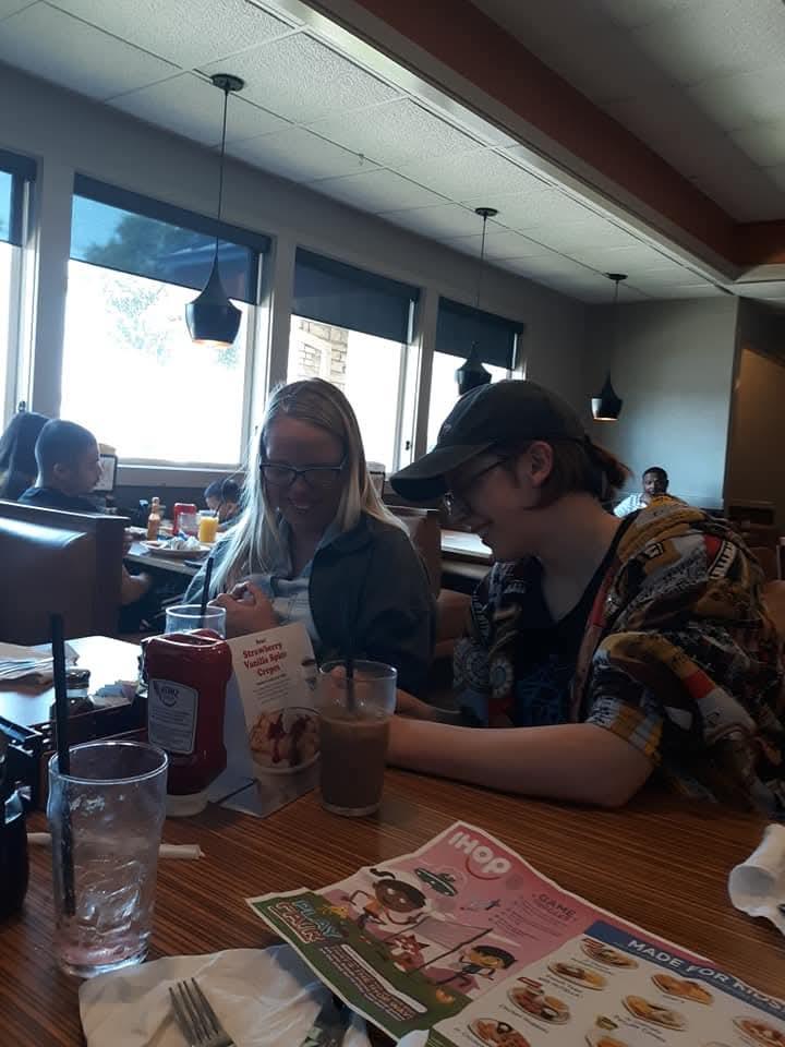 A man and woman sitting at a table