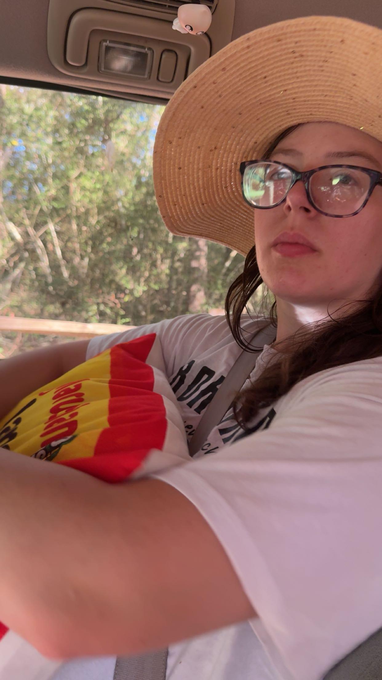 A woman wearing a hat and glasses