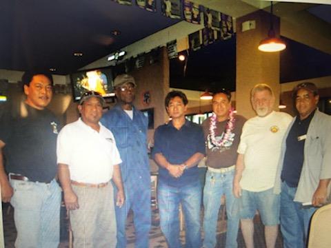 A group of men standing in a room