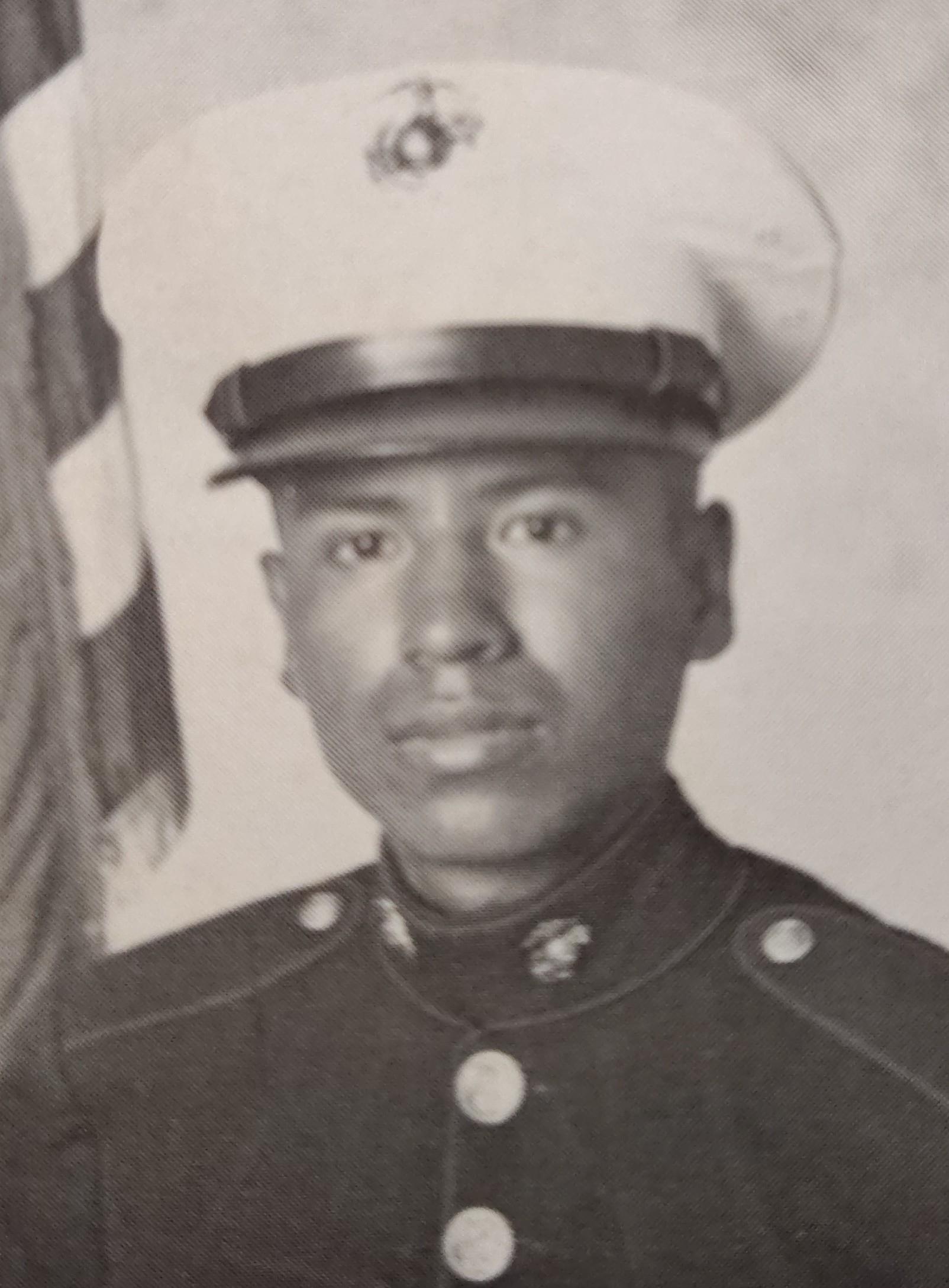 A man in uniform with a flag