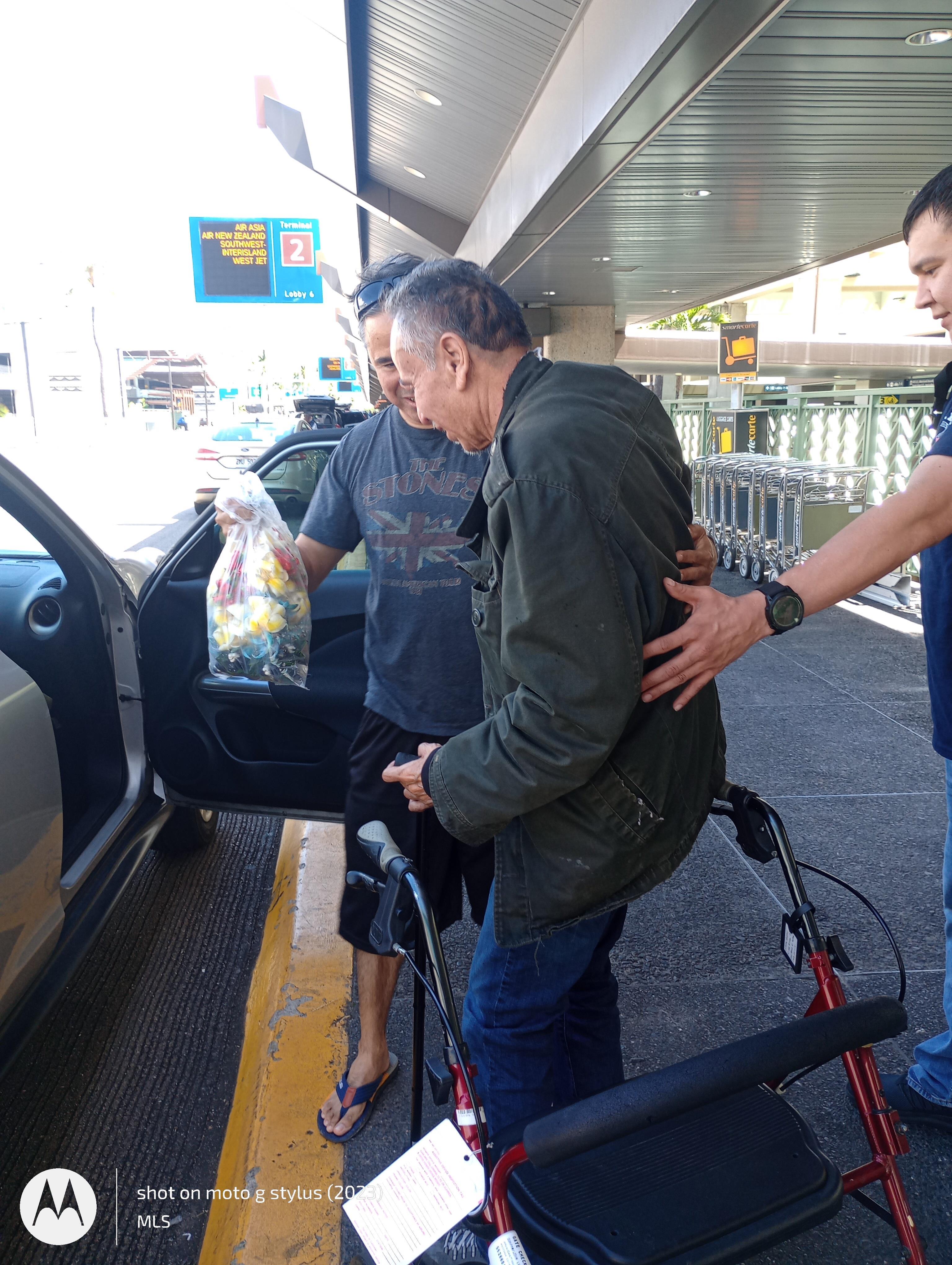 A man standing next to a bicycle
