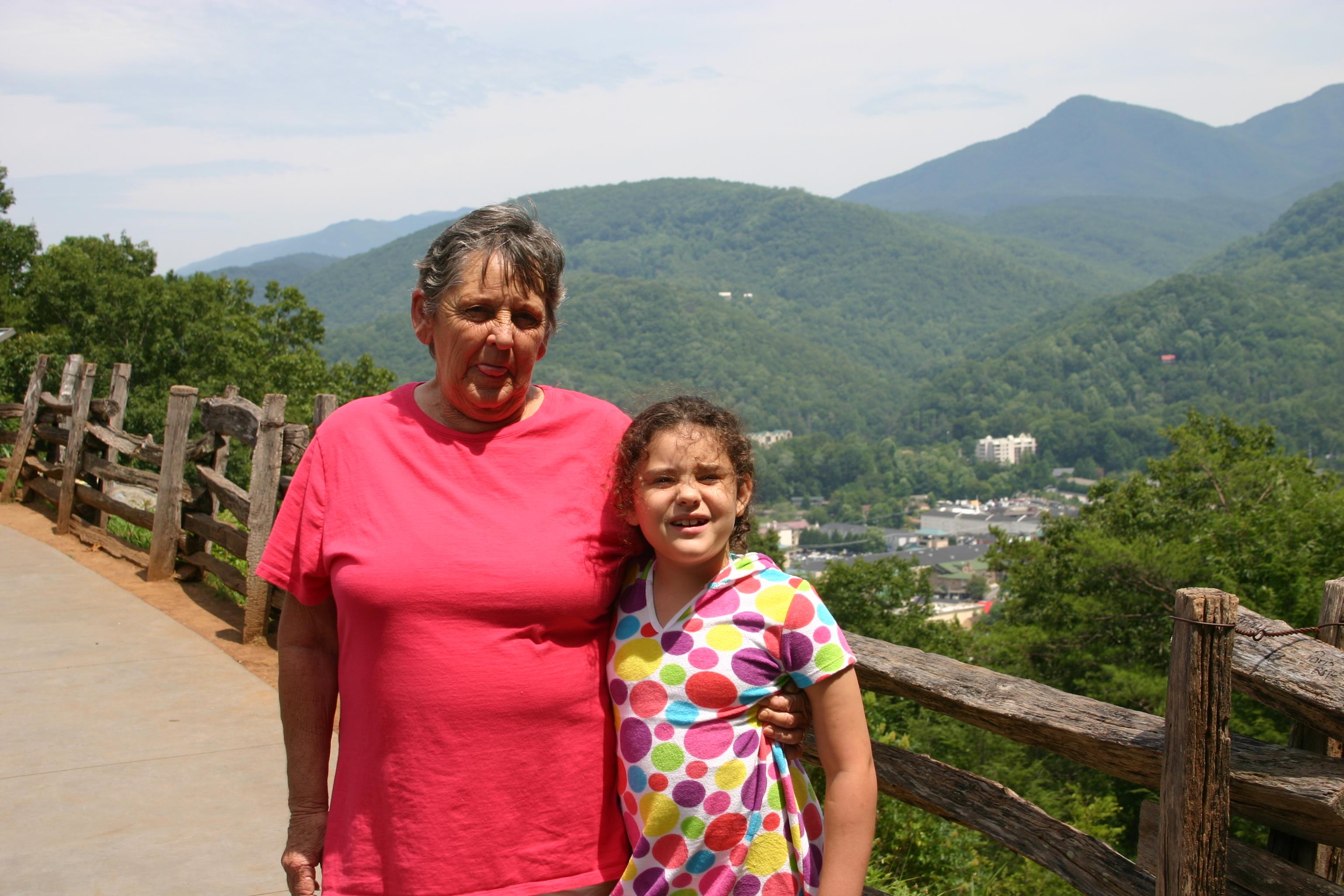 A woman and a girl posing for a picture