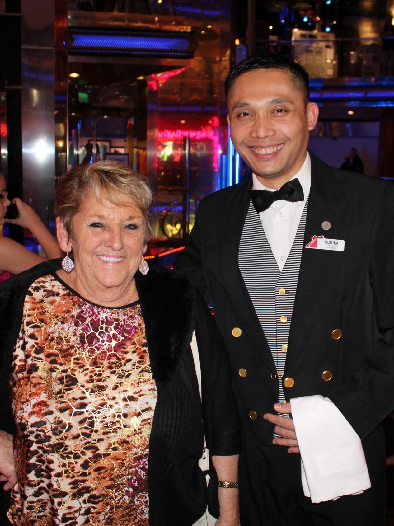 A man and woman smiling at the camera