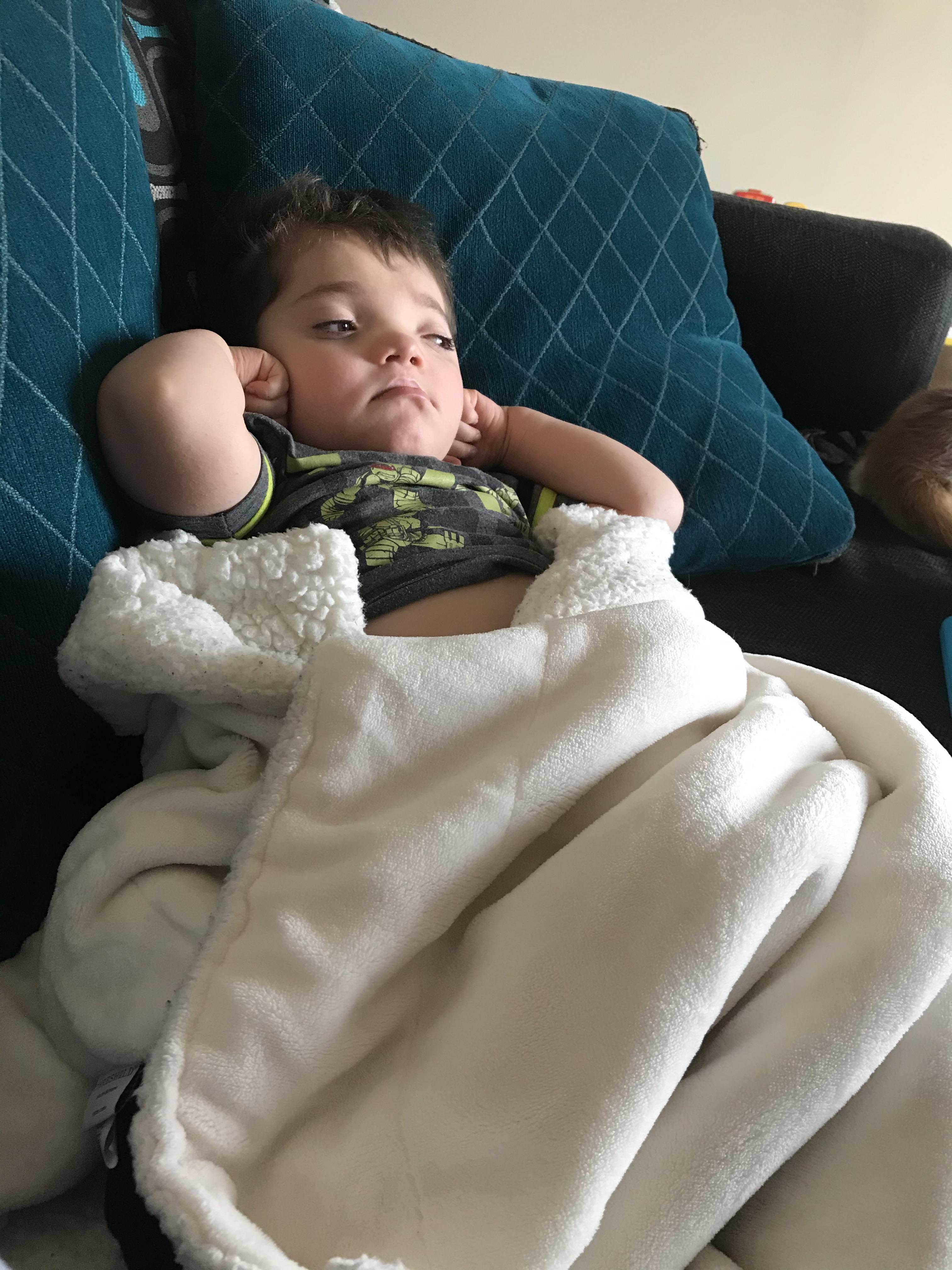 A child lying on a couch